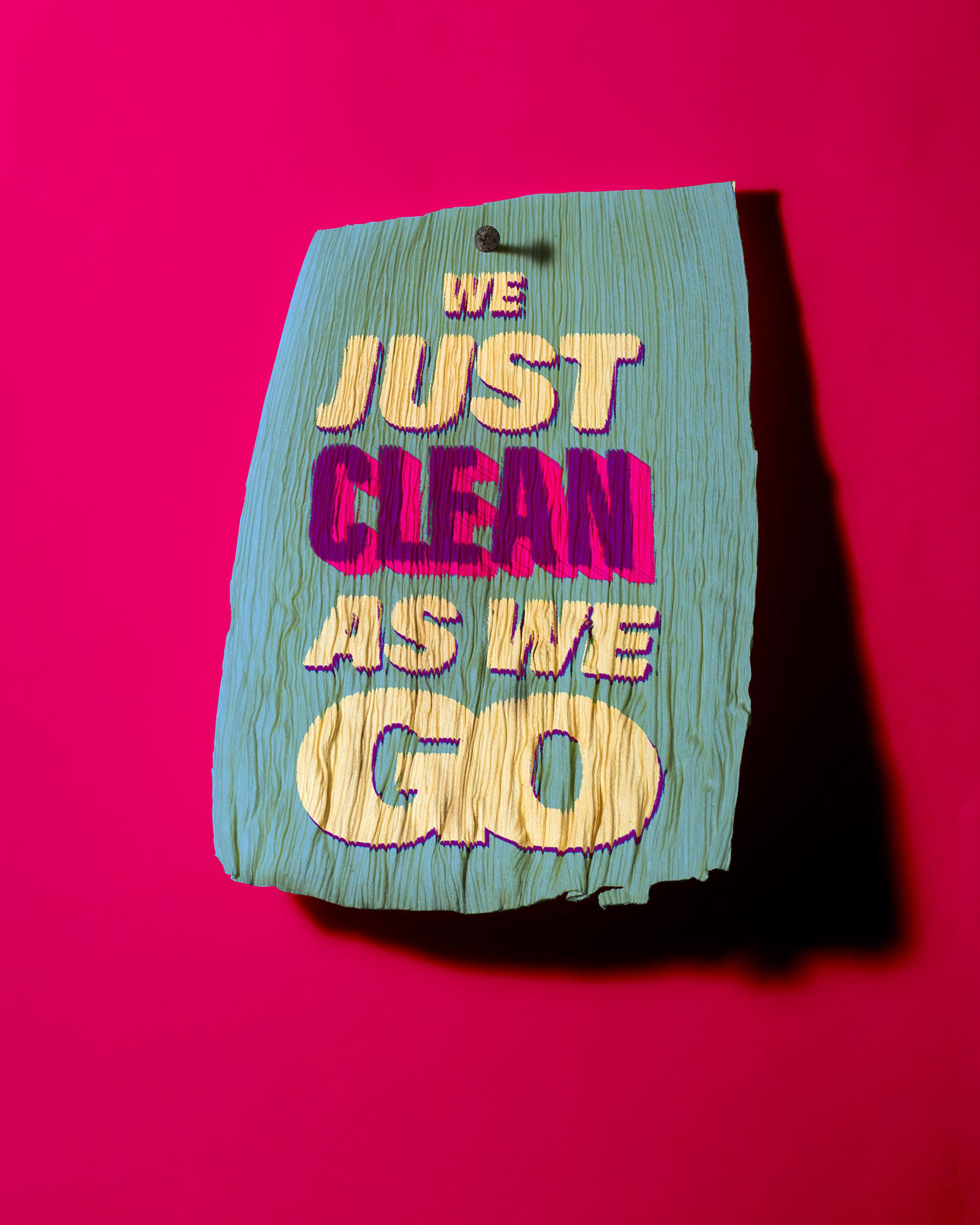 A tamale corn husk which says, "We just clean as we go."