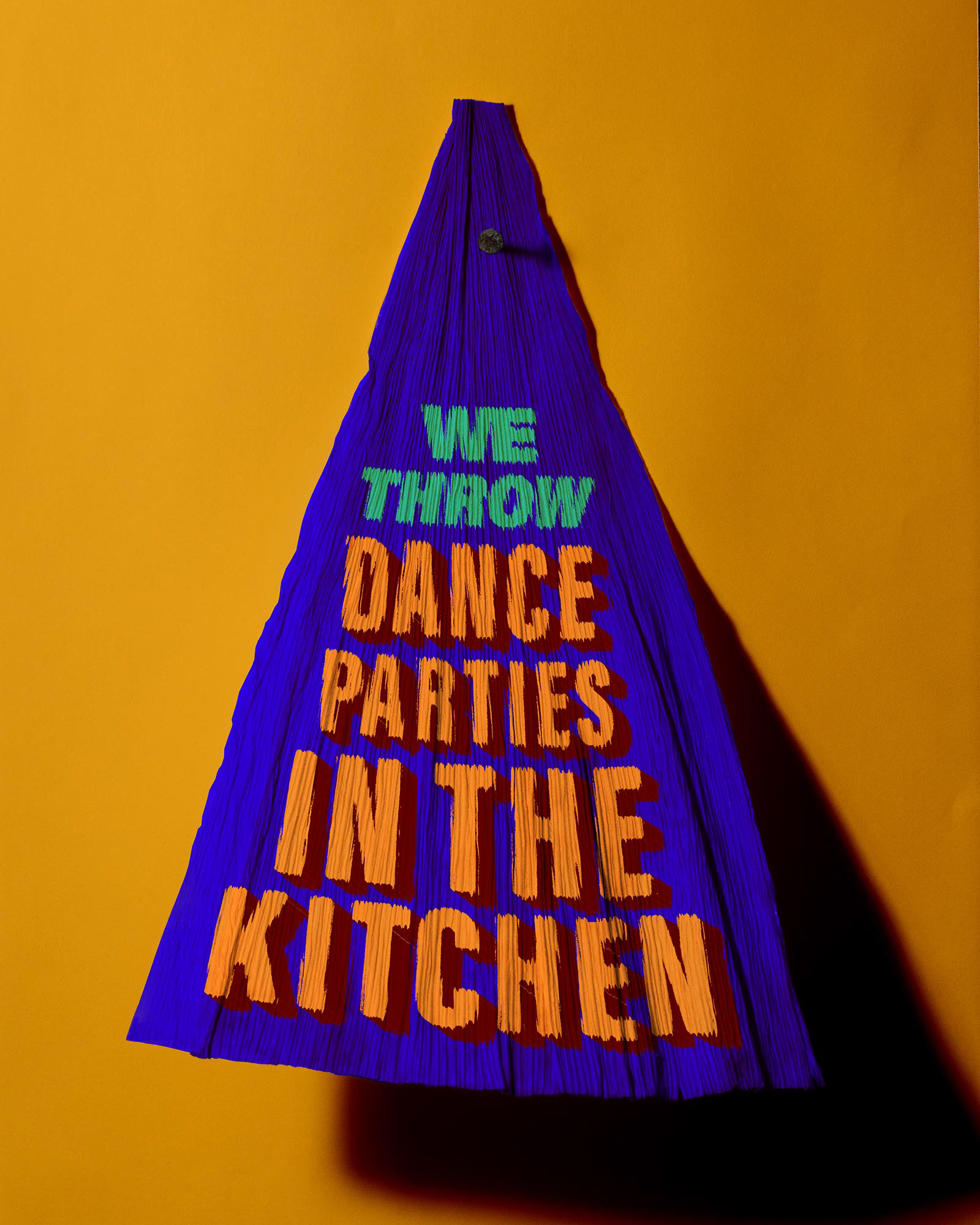 A tamale corn husk which says, "We throw dance parties in the kitchen."