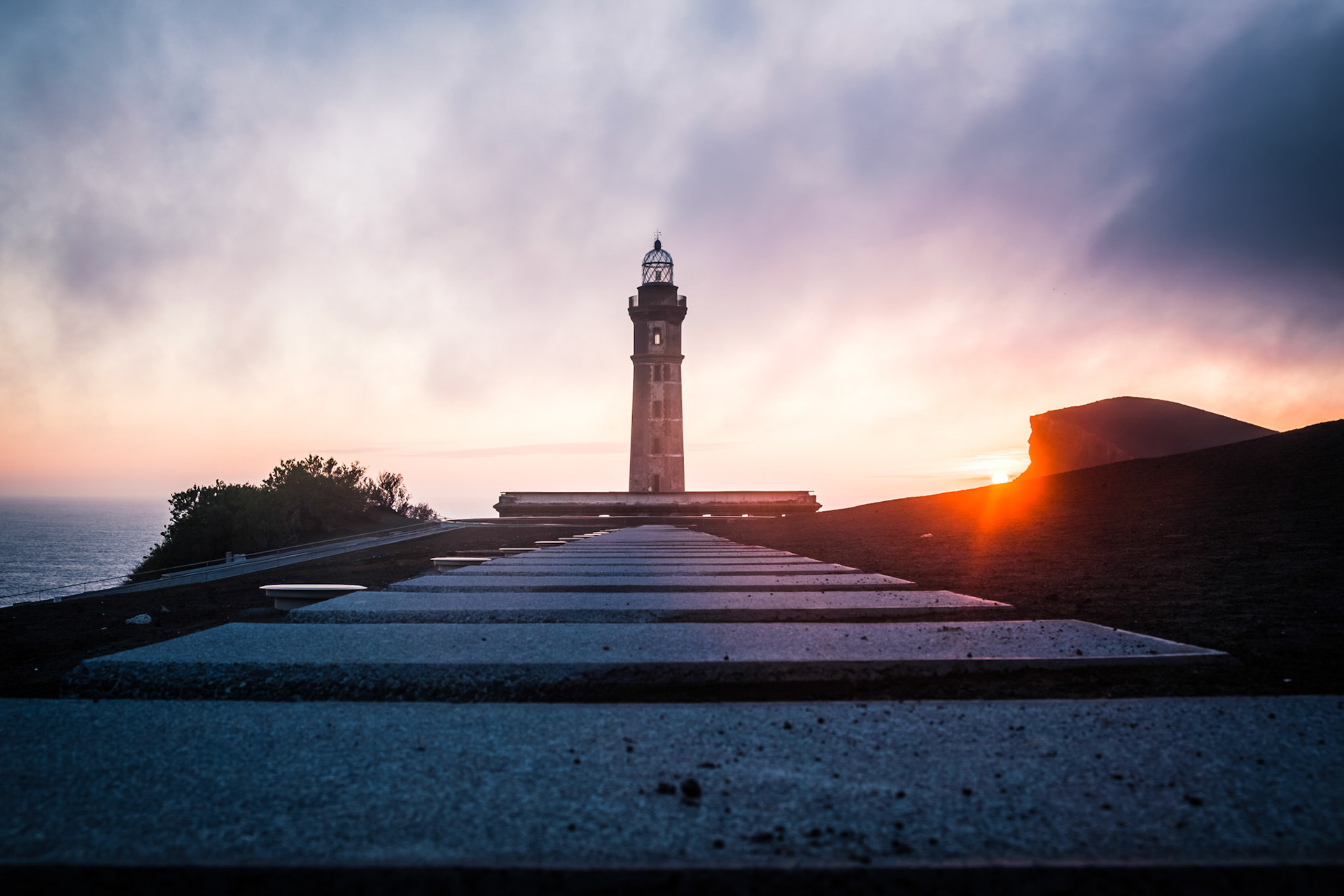 the life of the lighthouse of ponta dos capelinhos on the westernmost tip of faial was as adventurous as they get; an eruption of capelinhos volcano just one kilometre away from a lighthouse in 1957-58 destroyed all surrounding buildings and resulted in a rise of the volcanic cone (visible on the right) by more than 200 meters;