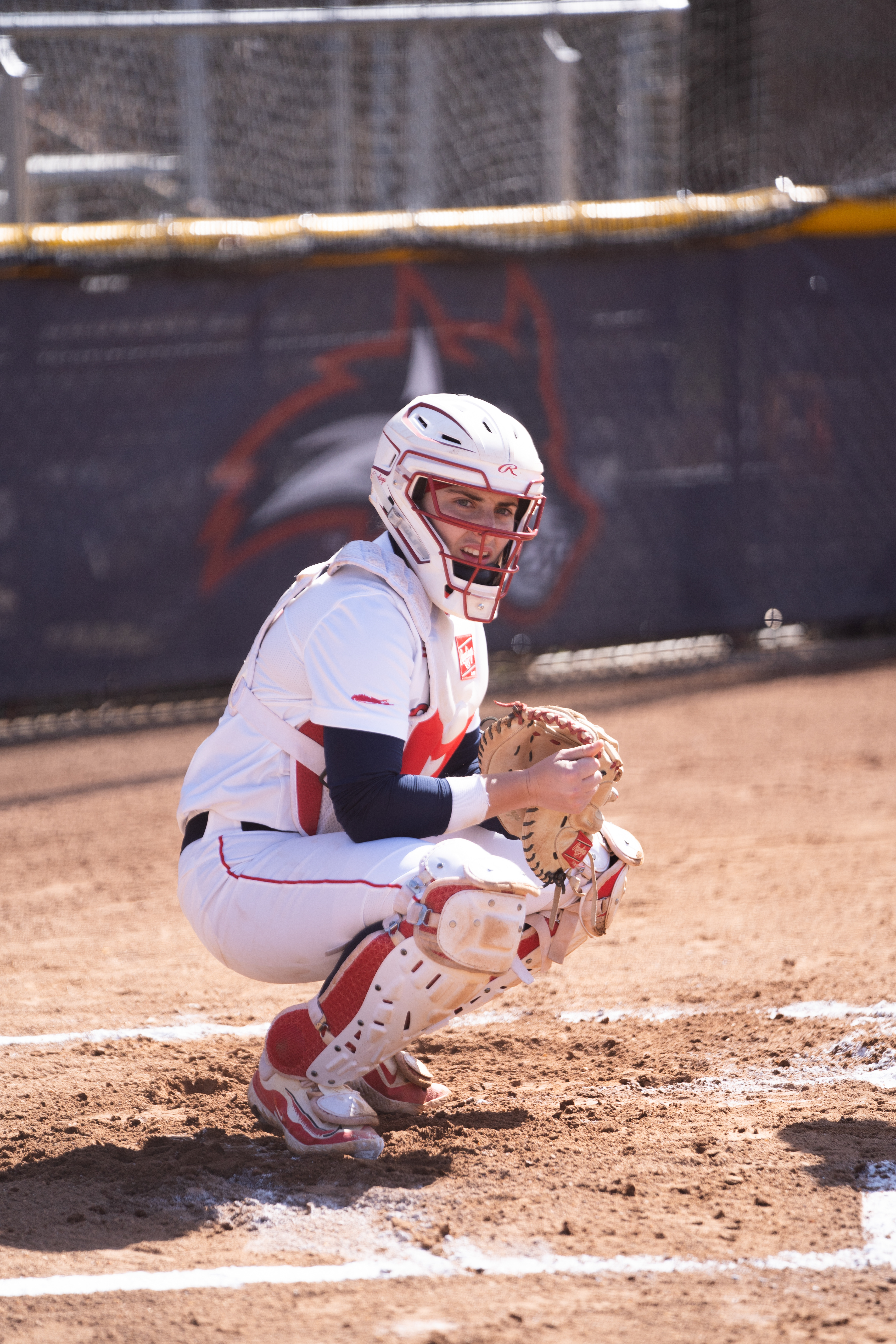 Emily Reinstein looking over at her pitching coach for the sign - Stony Brook, NY 3/8/2024