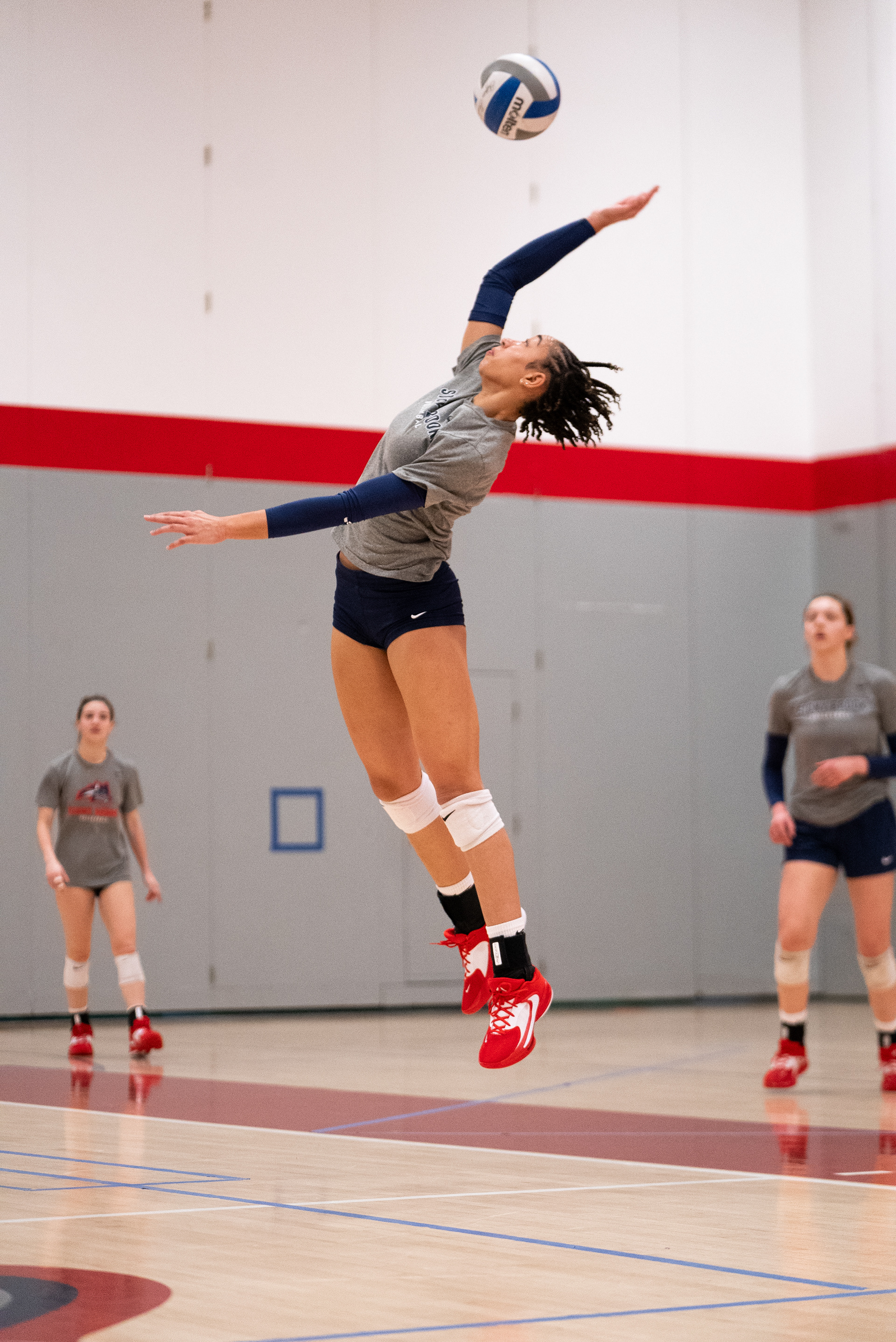 Ayanna Pierre Louis jumping to spike the ball during a practice scrimmage - Stony Brook, NY 3/6/2024