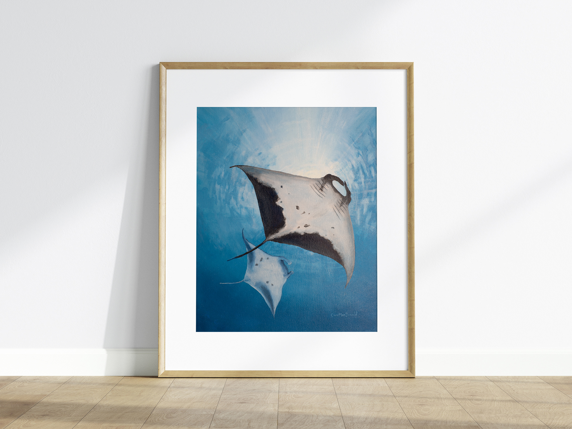 Acrylic painting of manta rays.