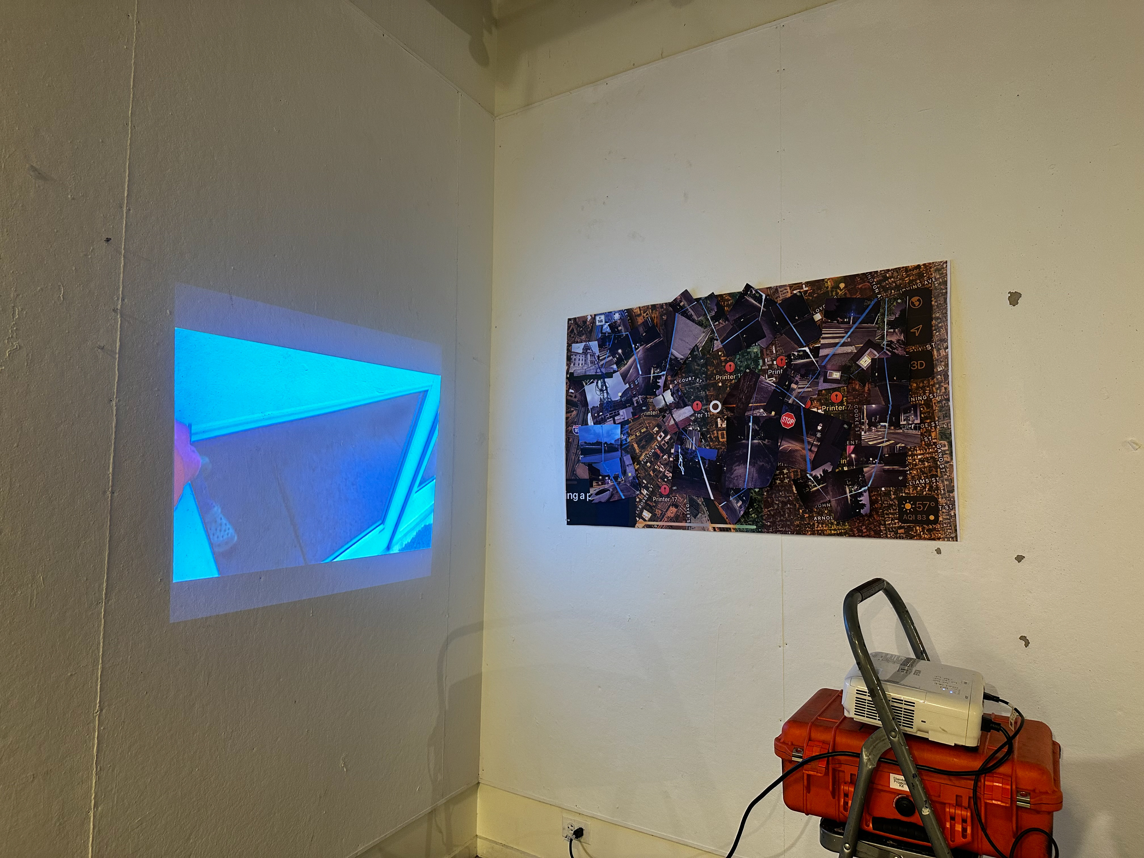 "Blue", single-channel video projection and cut-out prints, installation view