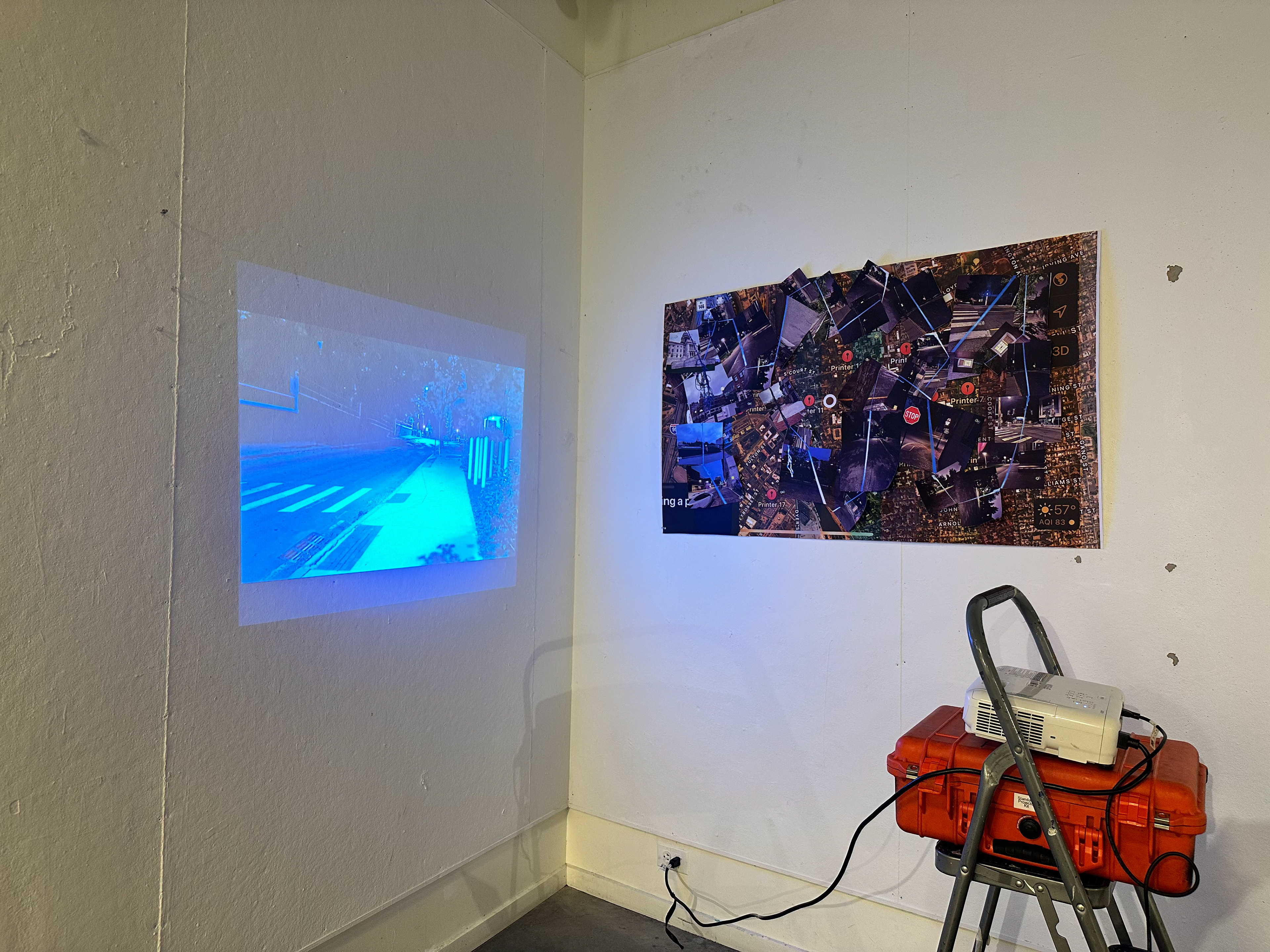 "Blue", single-channel video projection and cut-out prints, installation view