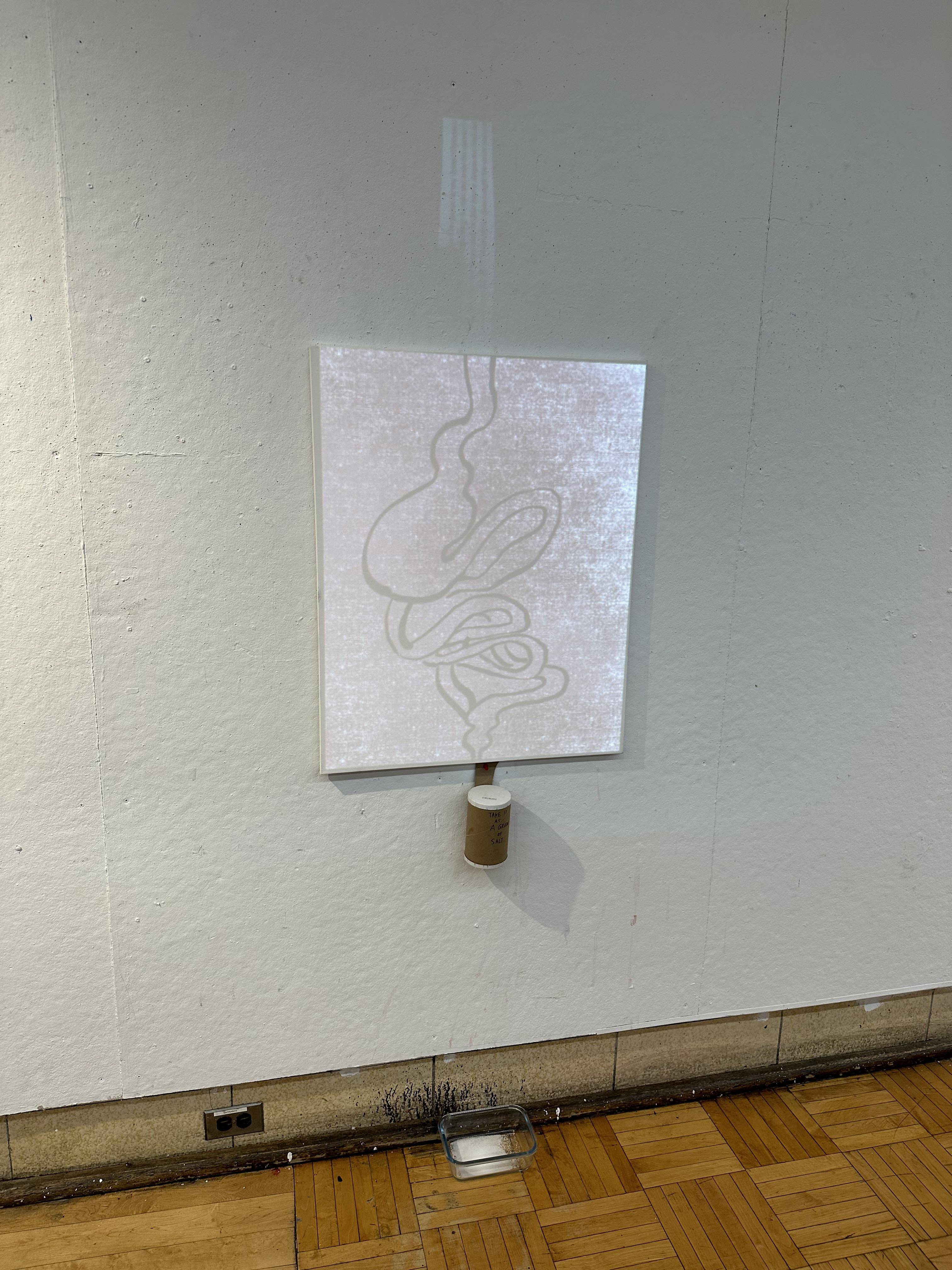 "Making Sand", a projection installation with canvas, salt, and container