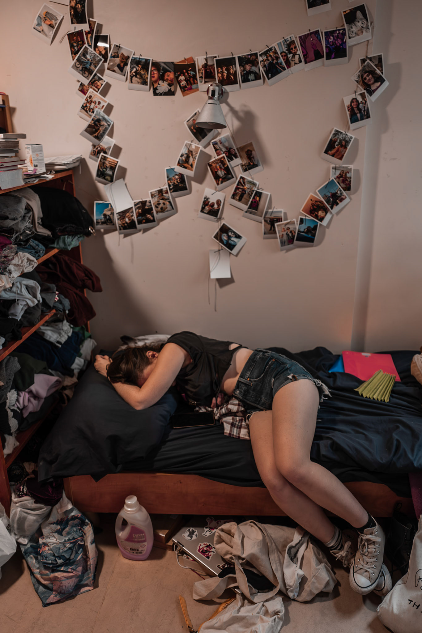 A student relaxes in her bedroom at AEPP, a student residence in Paris. The image portrays a moment of rest and privacy, offering a glimpse into the everyday routines and living conditions of residents. The calm atmosphere contrasts with the demands of academic and social life, emphasizing the role of the room as a place of comfort and recovery. Picture taken the 2026-06-01©Aurora Ghigino