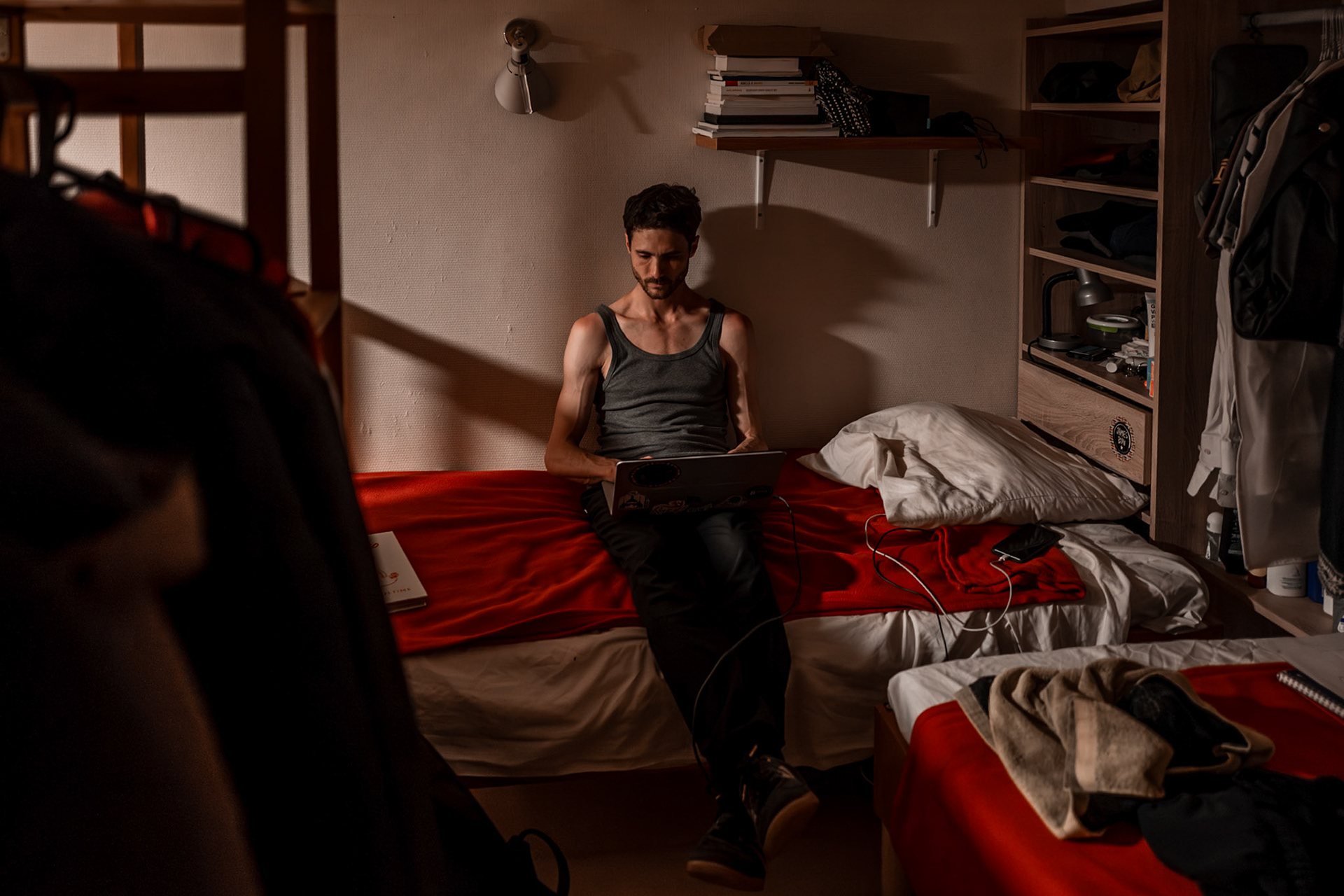 A self-reflaction moment of Alexis in his personal space, focusing on his laptop late at night.This simple moment gives a sense of calm where solitude, routine and intimacy cometogether to tell a story.Picture taken the 2026-05-30©Aurora Ghigino