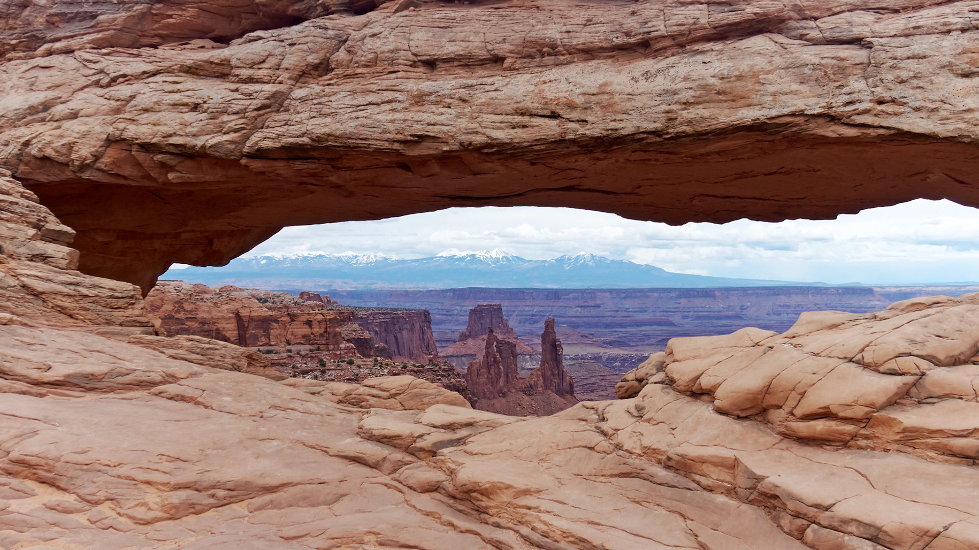 Mesa Arch, Island in the Sky, framing the Washer Woman Arch and the La Sal Mountains.