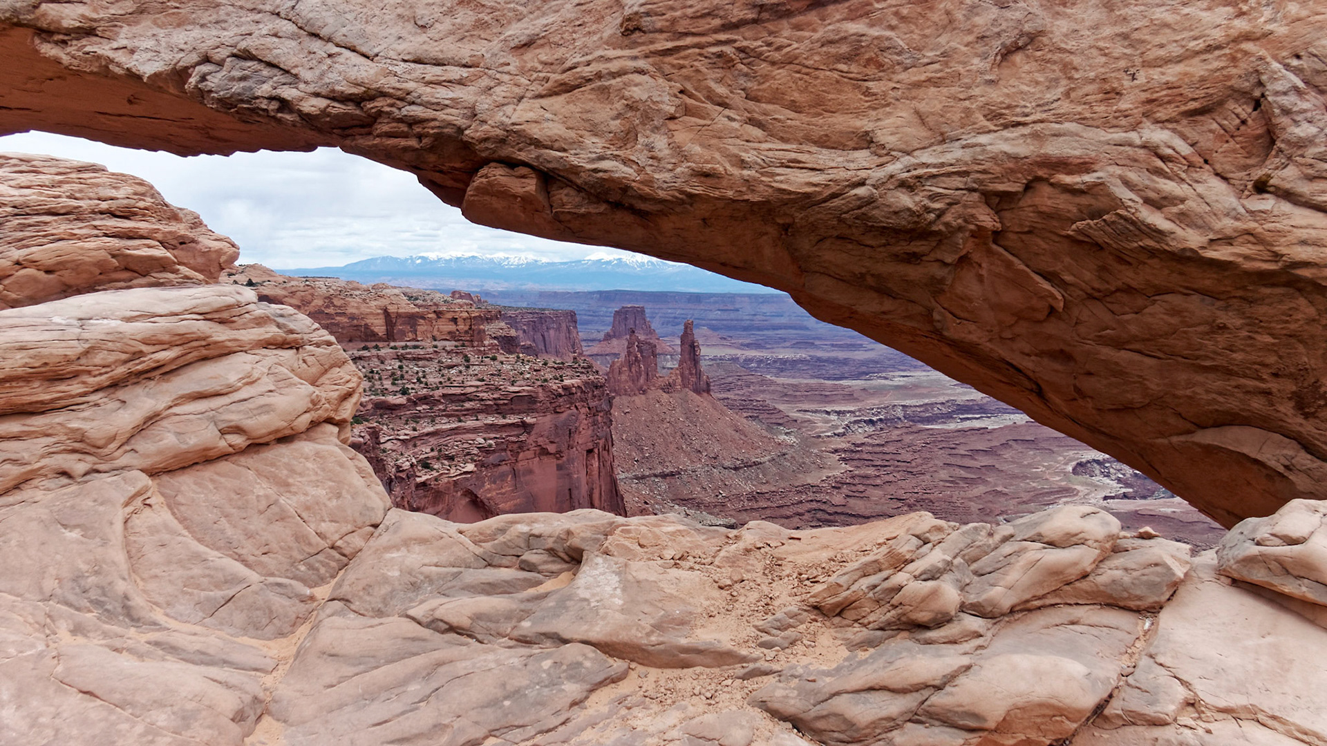 Mesa Arch, Island in the Sky, framing the Washer Woman Arch and the La Sal Mountains.