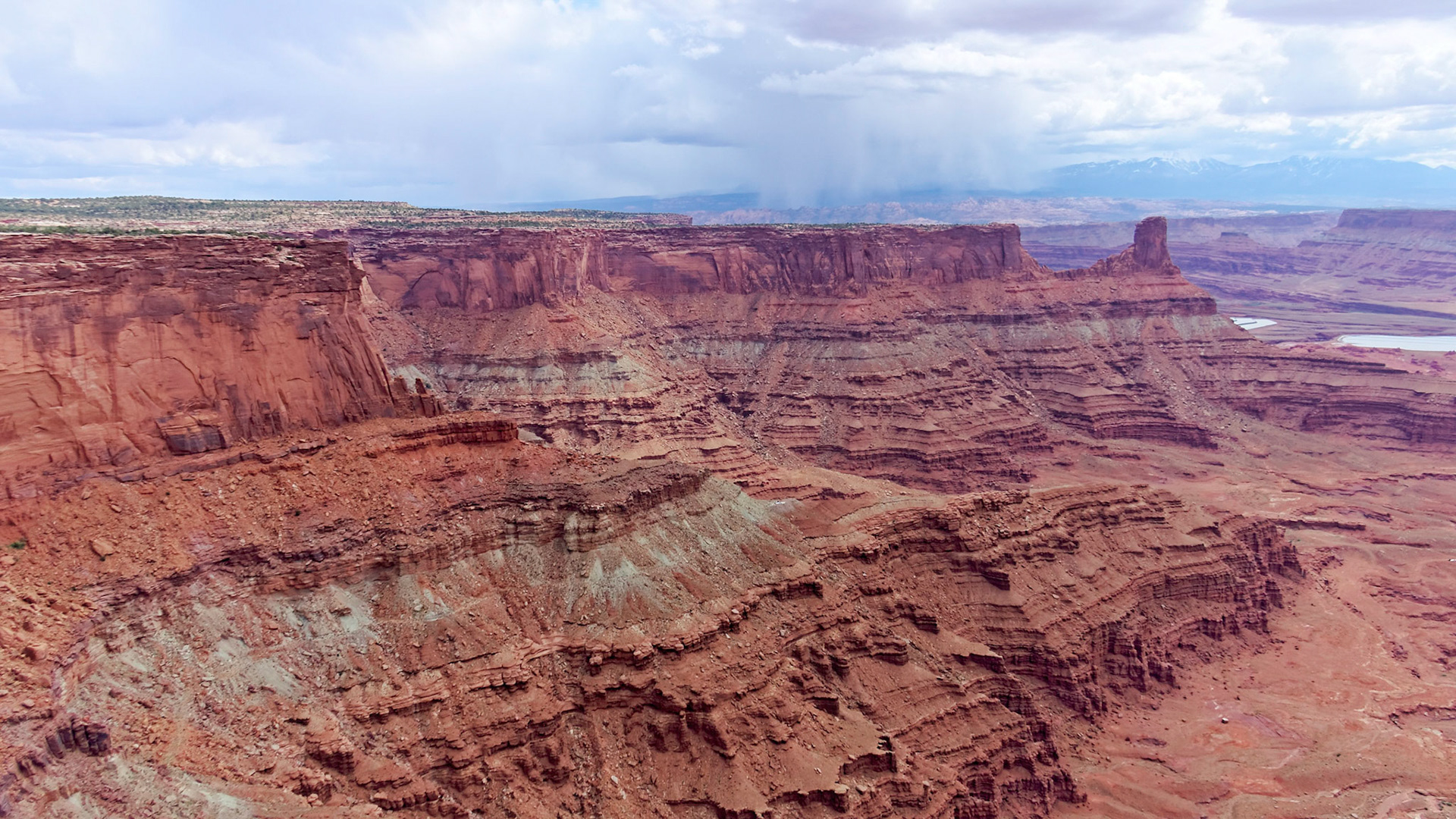 A spring shower over Moab, from Dead Horse Point.