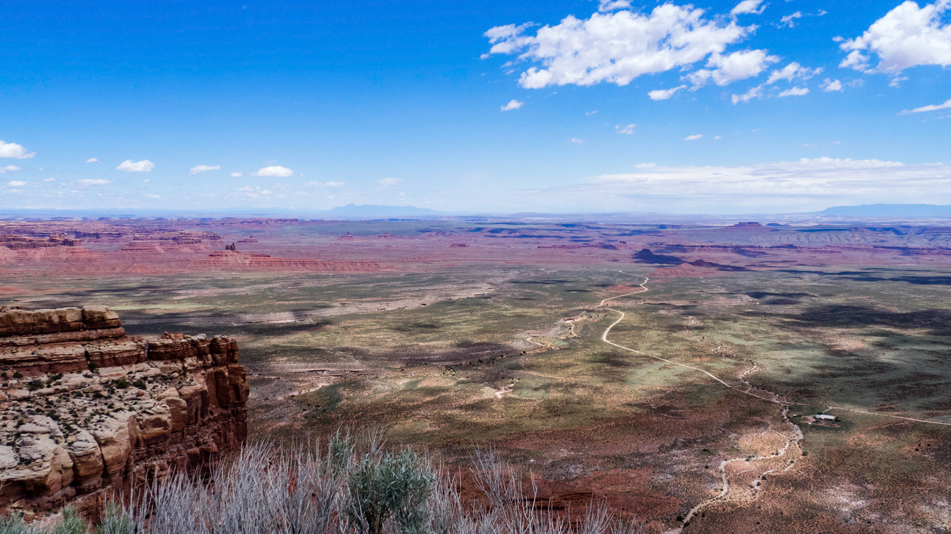 View from the Moki Dugway showing the road through the Valley of the Gods with the B&B in the right foreground.
