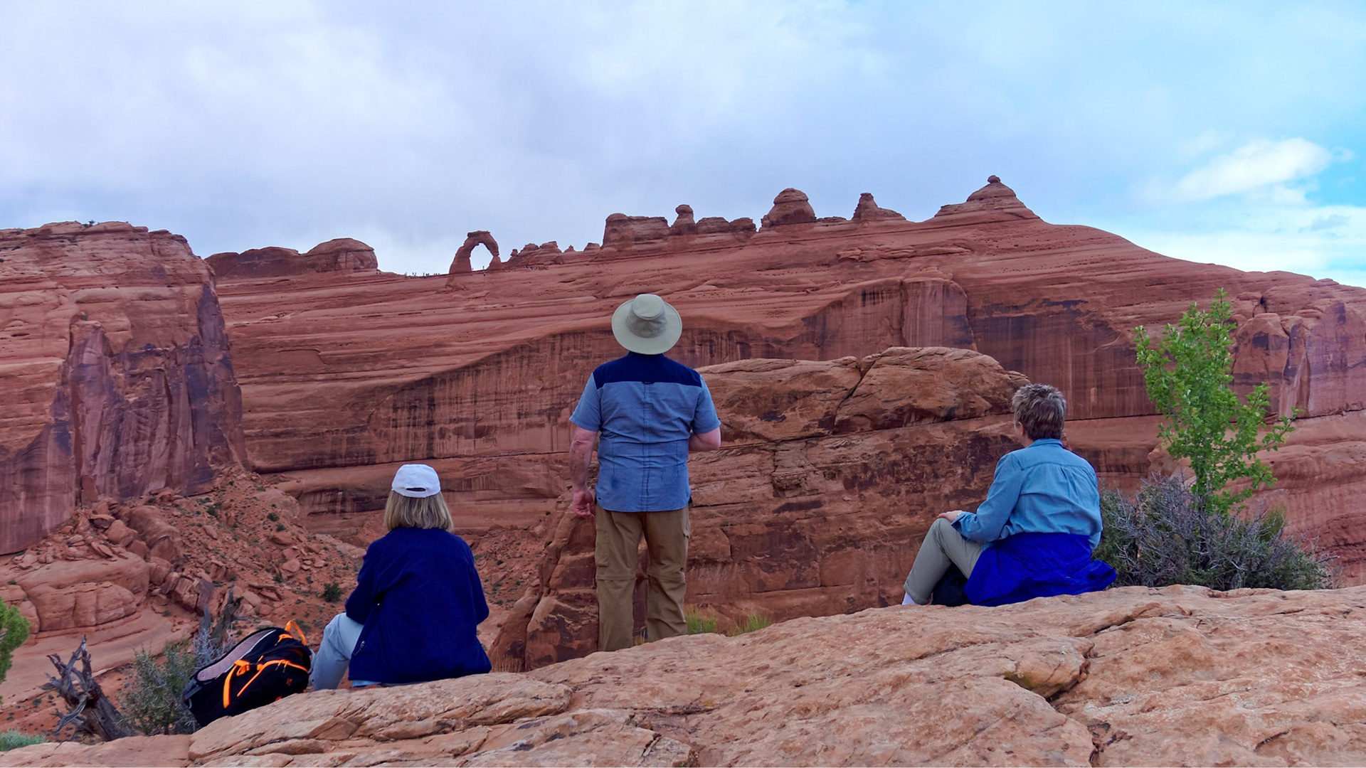 Judith, Serge and Jenny admire Delicate Arch from the viewpoint.