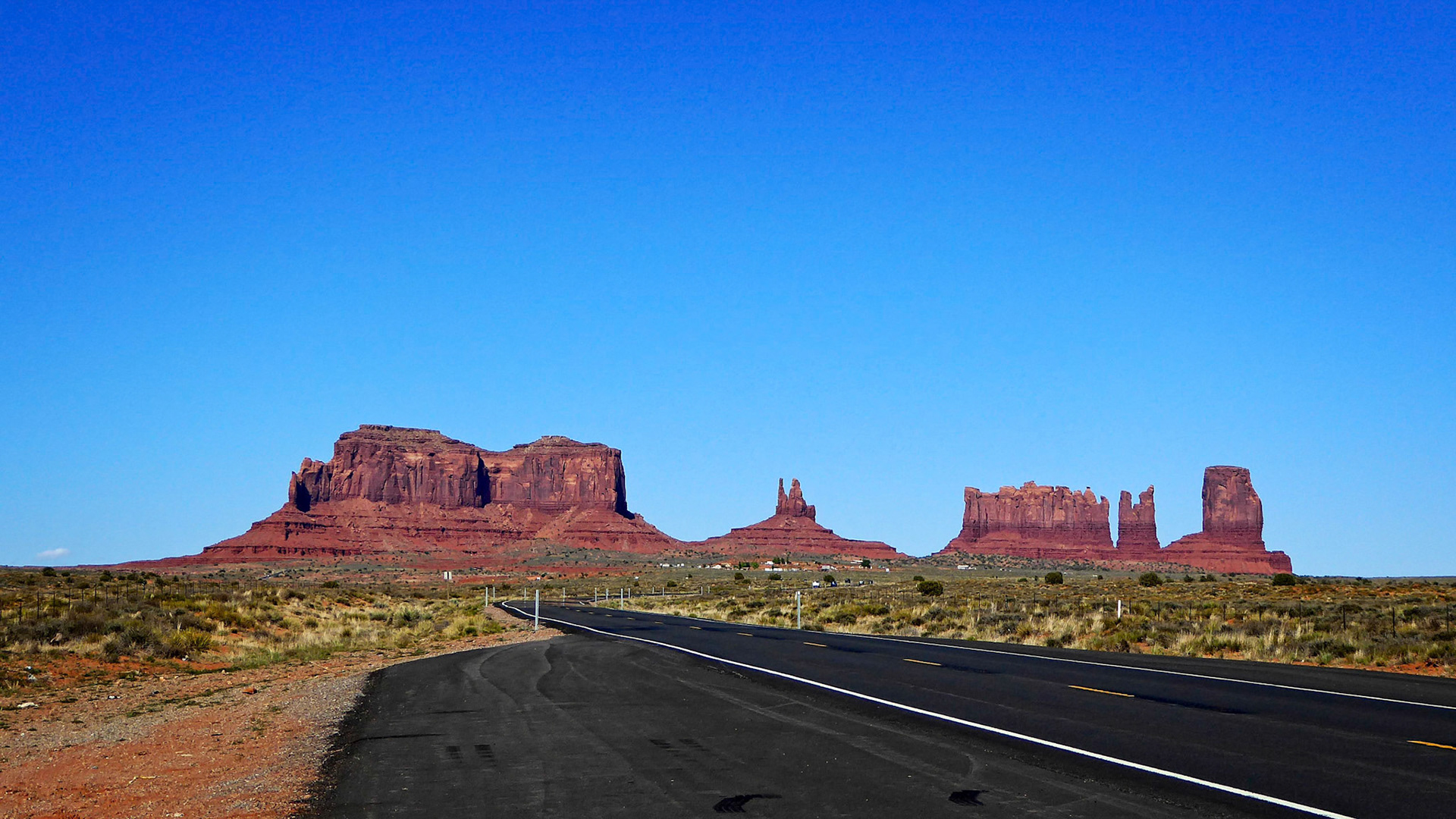Monument Valley from Route 163. From left to right, Brigham's Tomb, King On His Throne, Stagecoach, The Bear and Rabbit and Castle Butte.