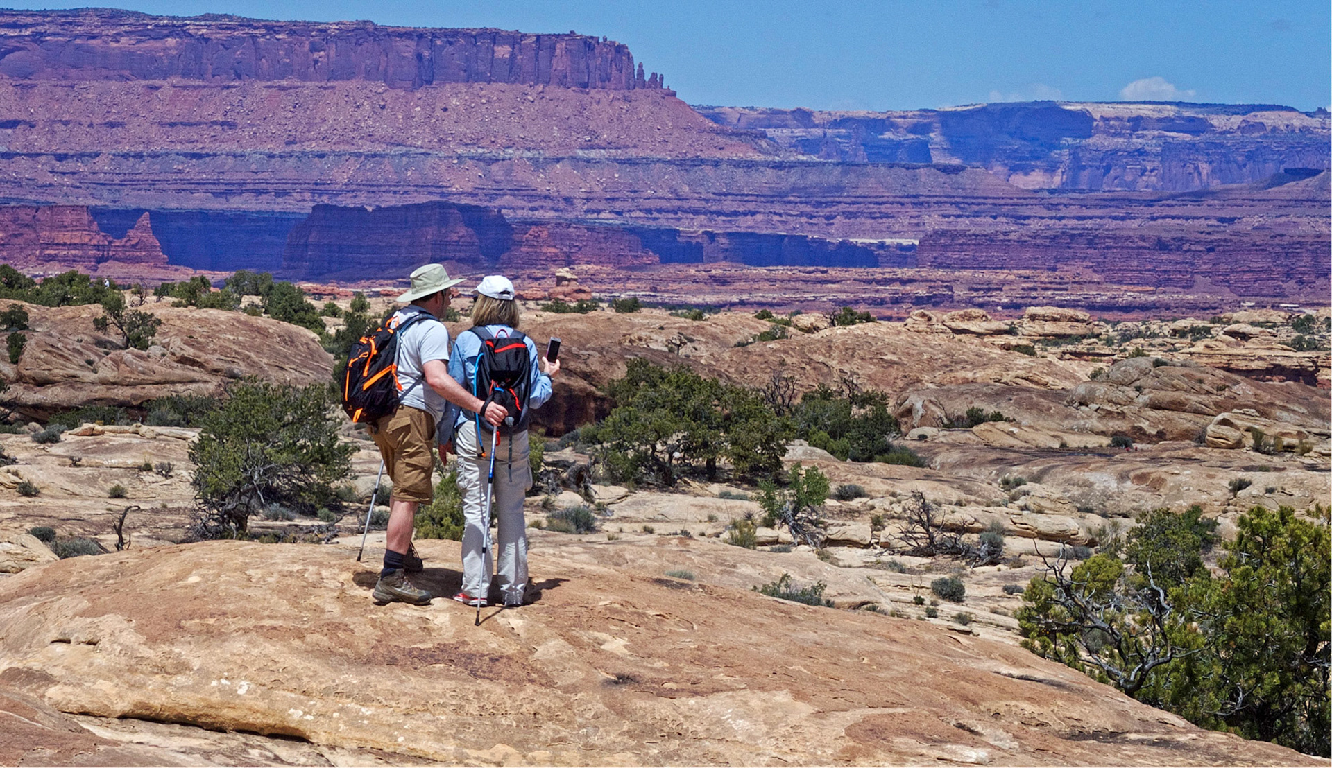 Judith and Serge looking towards the Island in the Sky from the Slickrock Foot Trail in the Needles District, Canyonlands National Park.
