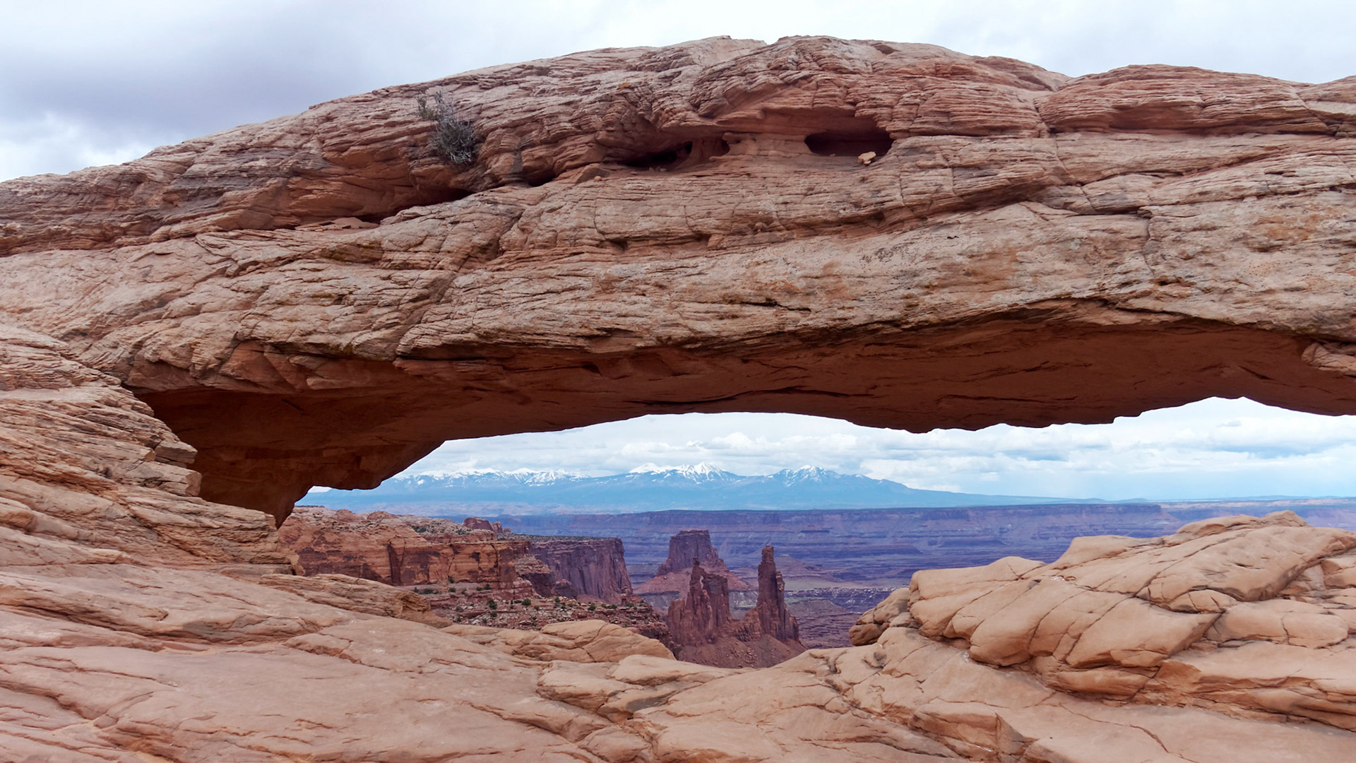 Mesa Arch, Island in the Sky, framing the Washer Woman Arch and the La Sal Mountains.