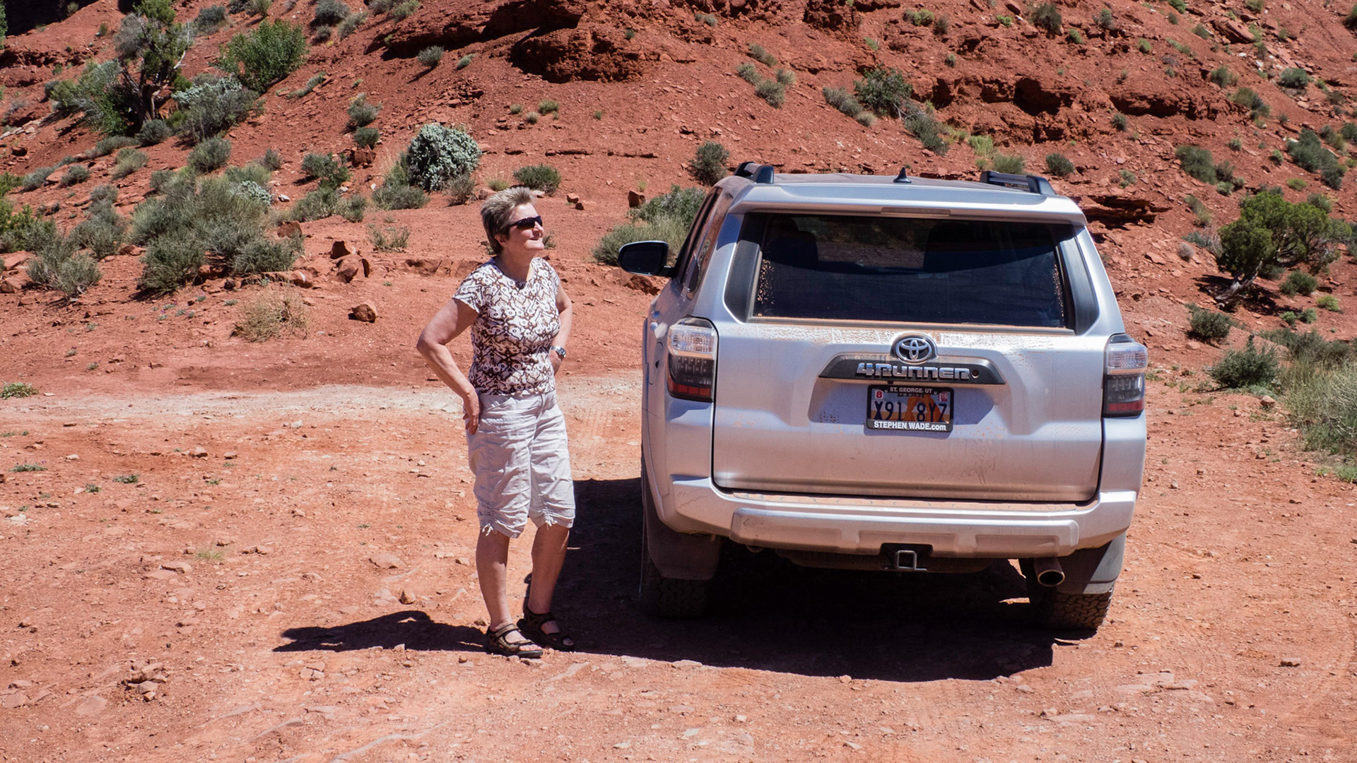 Jenny and the sandy 4Runner in the Valley of the Gods.