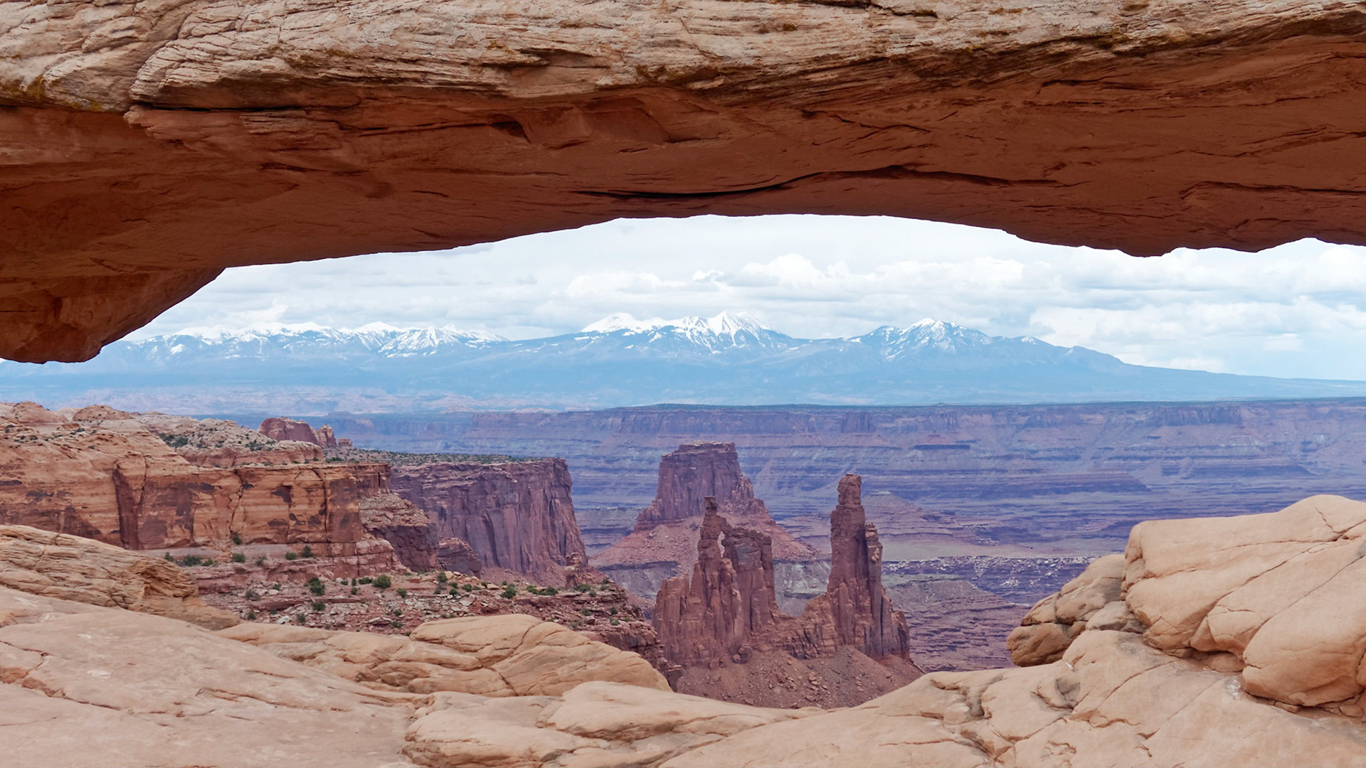 Mesa Arch, Island in the Sky, framing the Washer Woman Arch and the La Sal Mountains.
