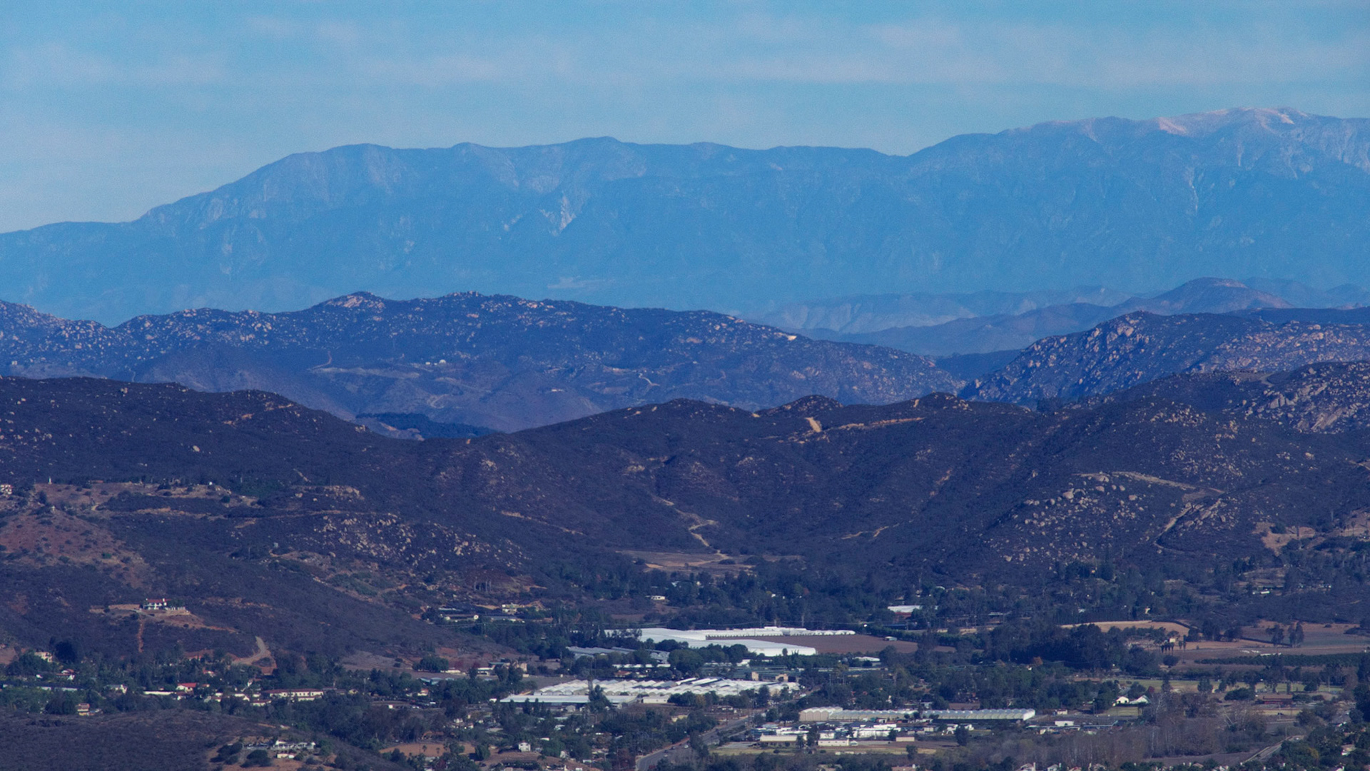 View from Double Peak Park, San Marcos, California. Looking north to the San Bernadino Mountains around Big Bear, over 70 miles away.