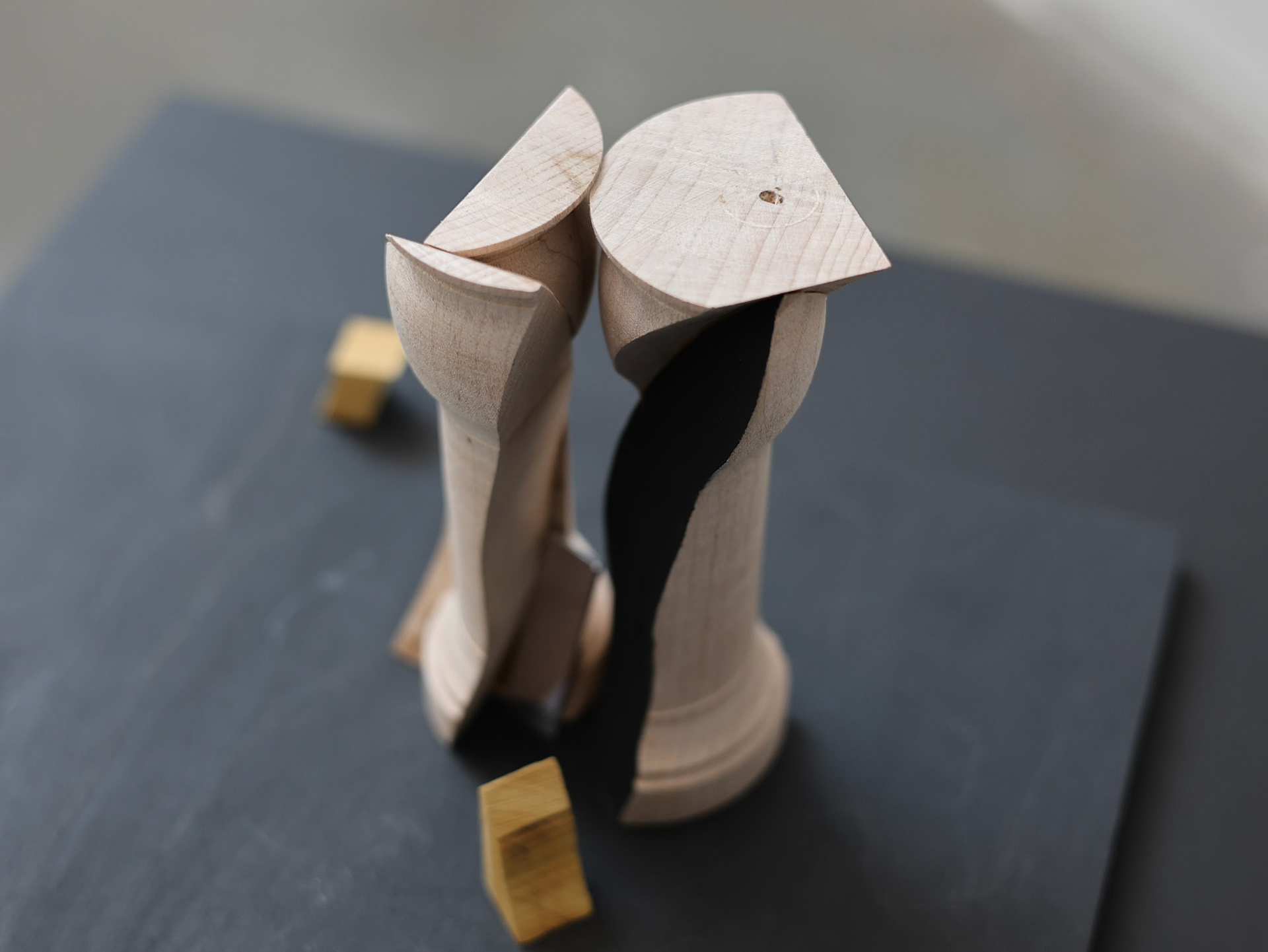 "hand over hungry hand…. ", freeform oak lathe turned, bandsaw sculpture with black paint