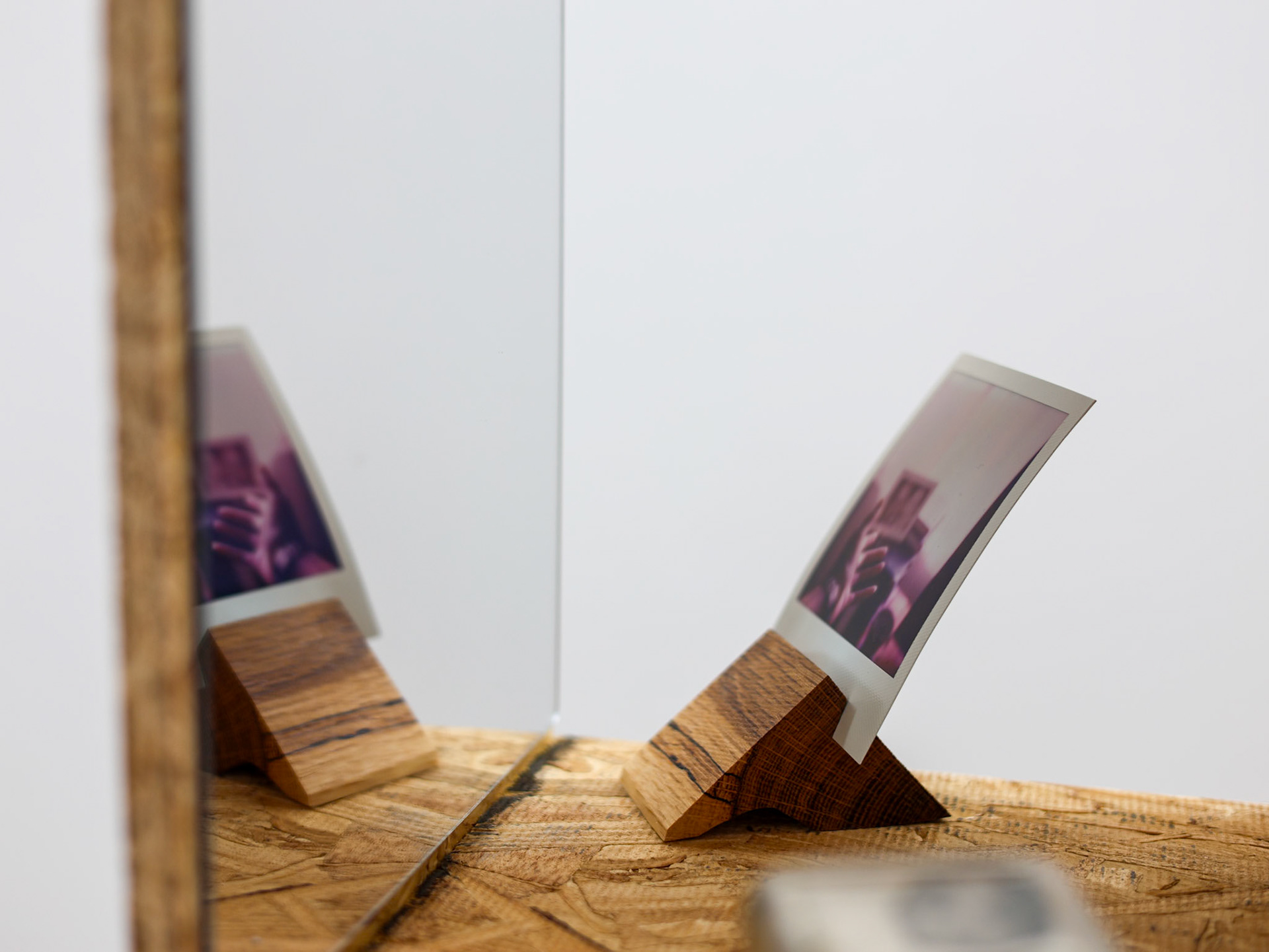 "See Through", Polaroid in black limba wood stand