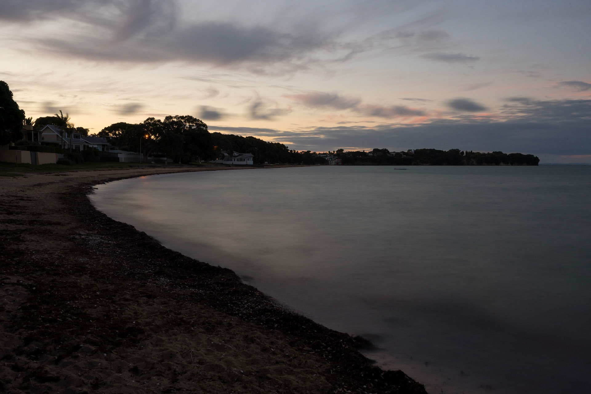 A long exposure photo of Chelthenham Beach, Auckland.