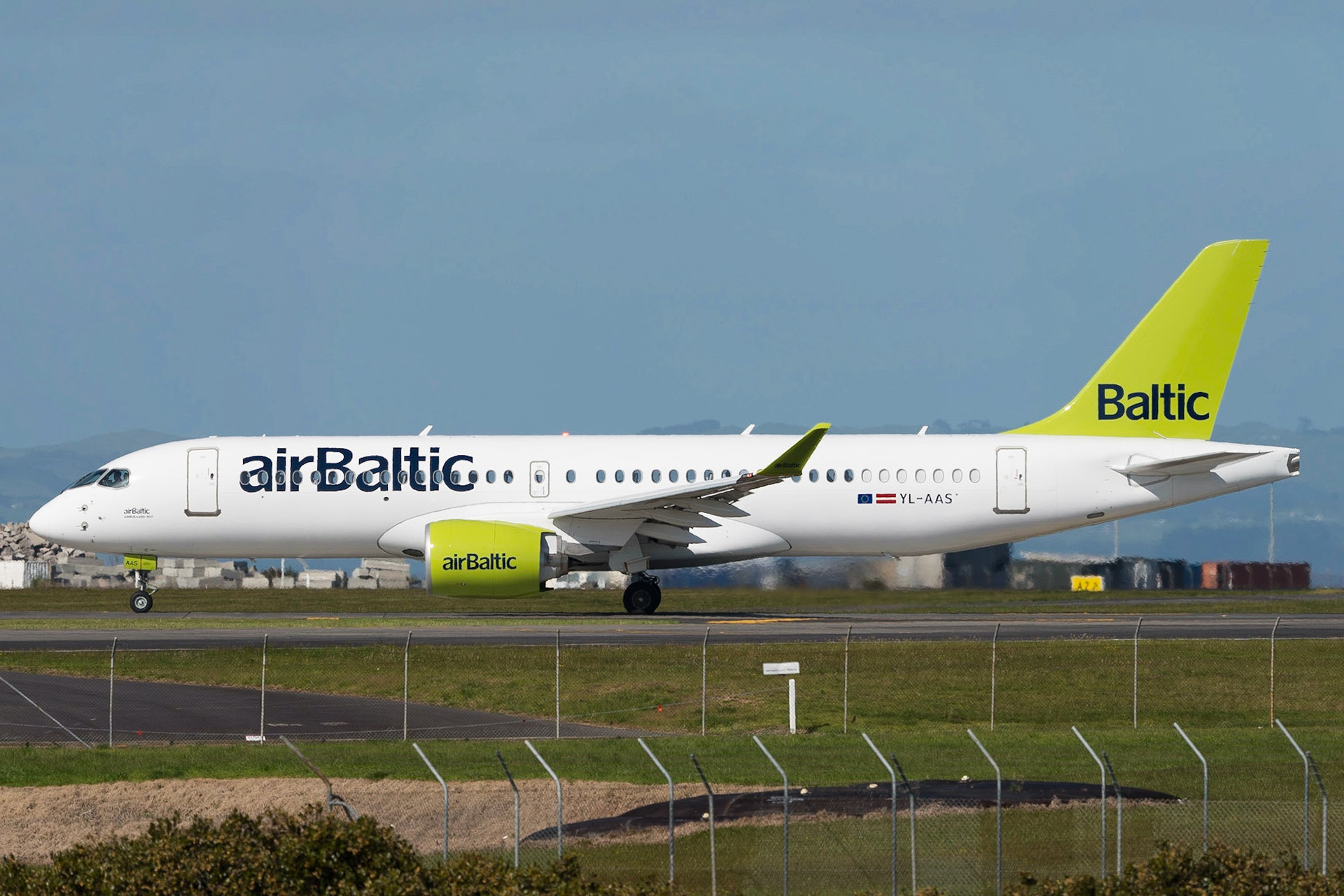 Air Baltic Airbus A220 YL-AAS departing Auckland, as part of a demonstration tour.