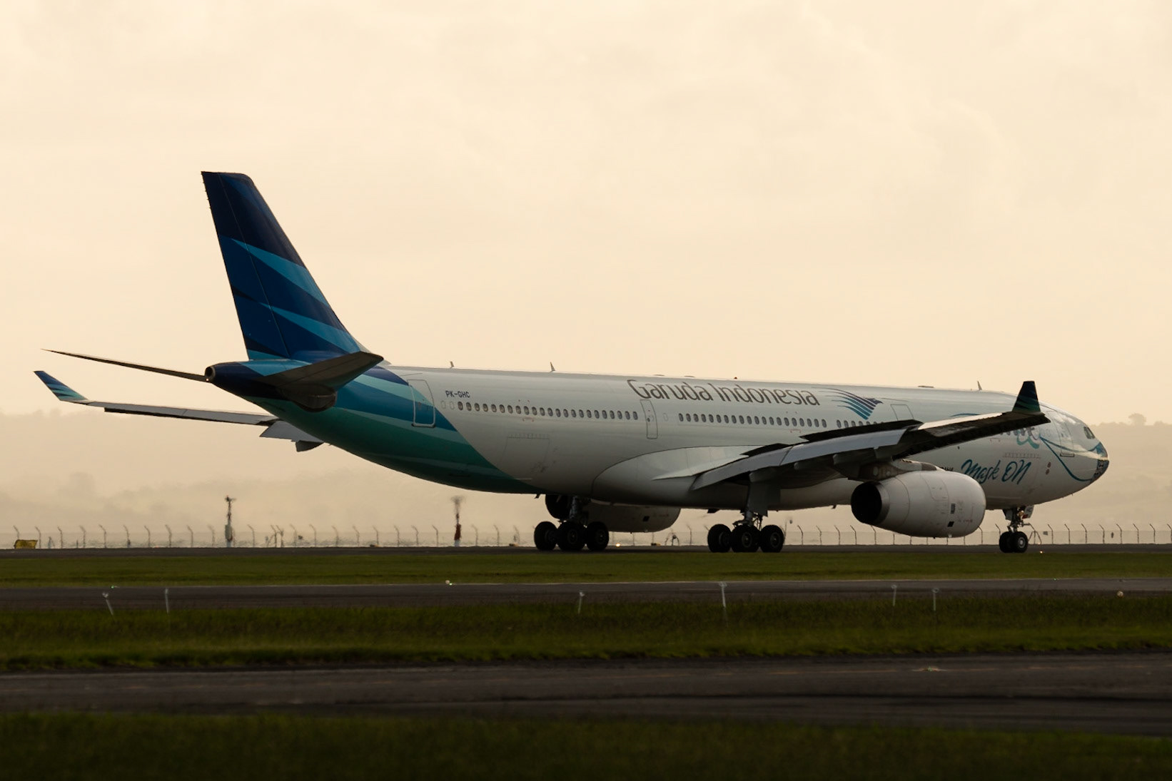Garuda Indonesia Airbus A330-300 PH-GHC arriving in Auckland, showing signs of the times.