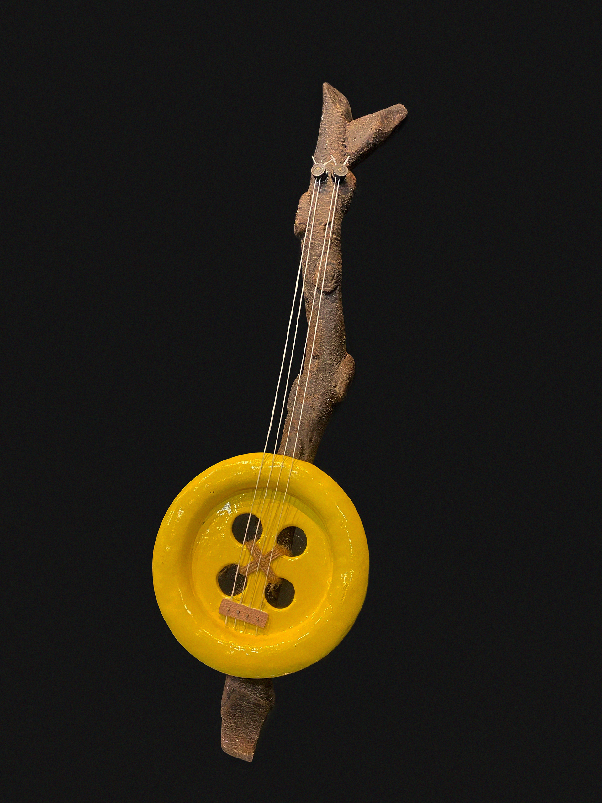 The Button Banjo - Laser Cut, Pink Foam Sculpting, Resin, and Paint.