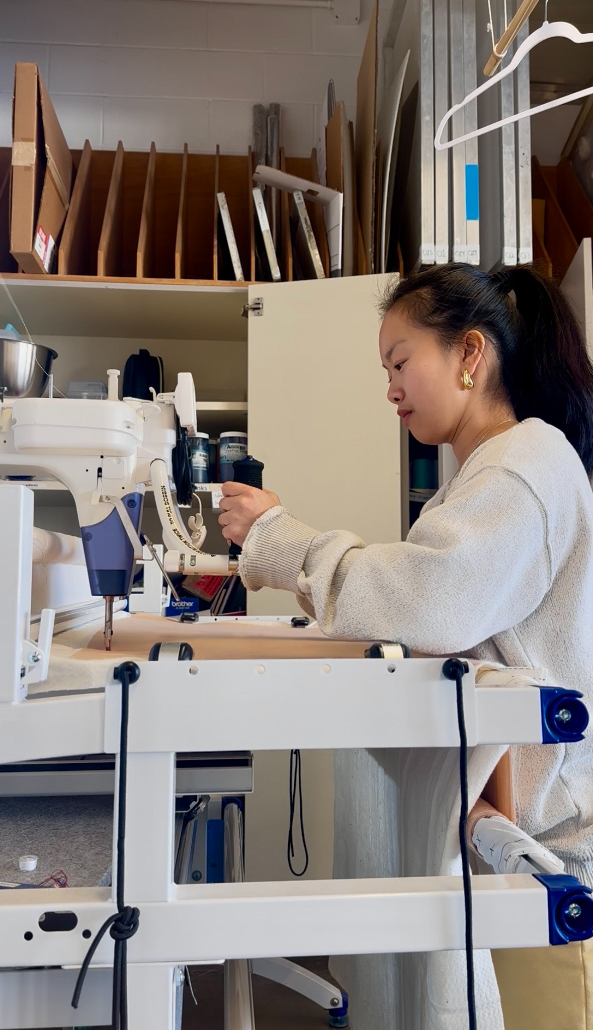 Using the long-arm quilting machine to quilt the sleeves and front and back bodice of my jacket.