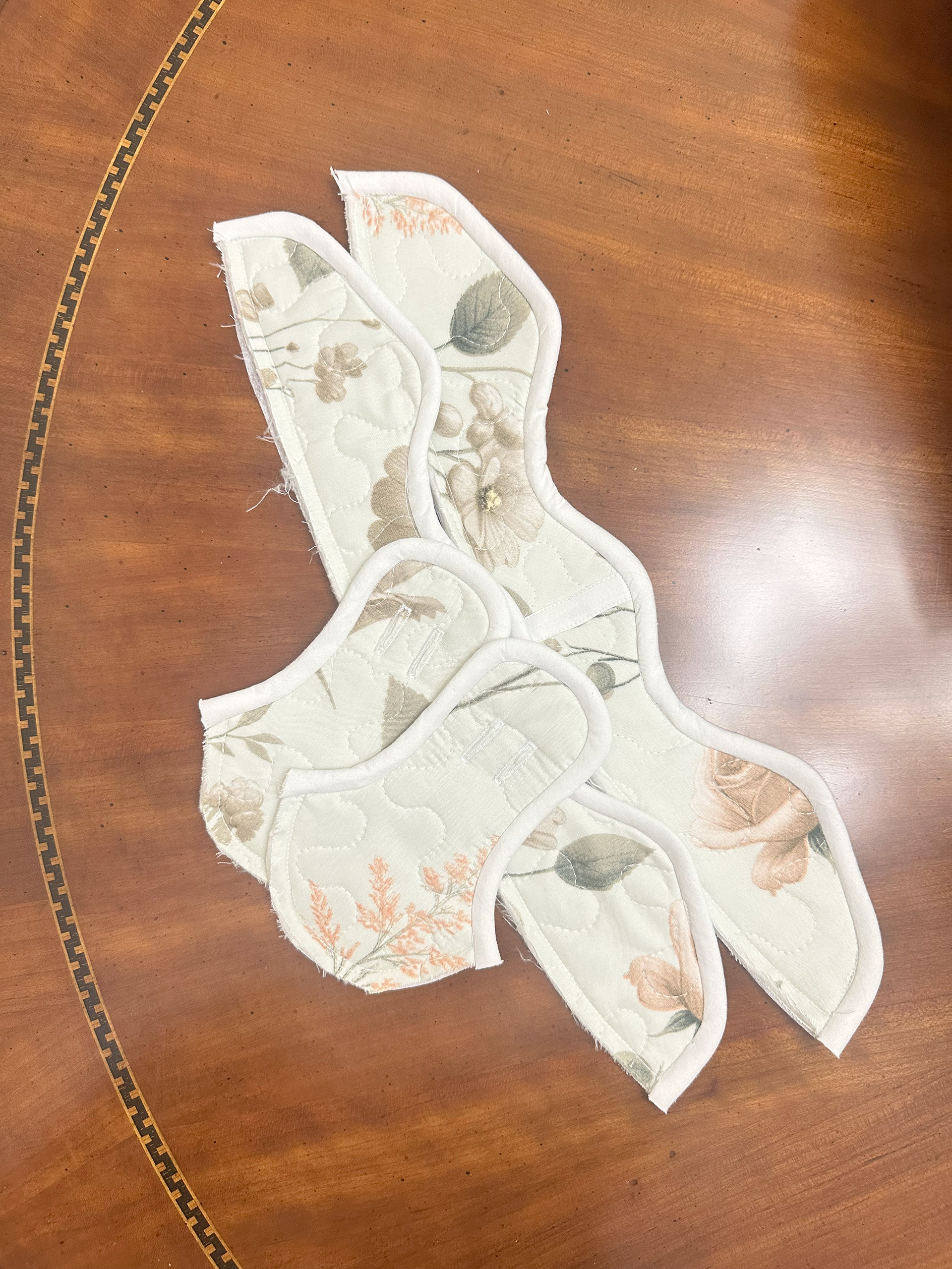 The shoe panels sewn together with a binded edge.