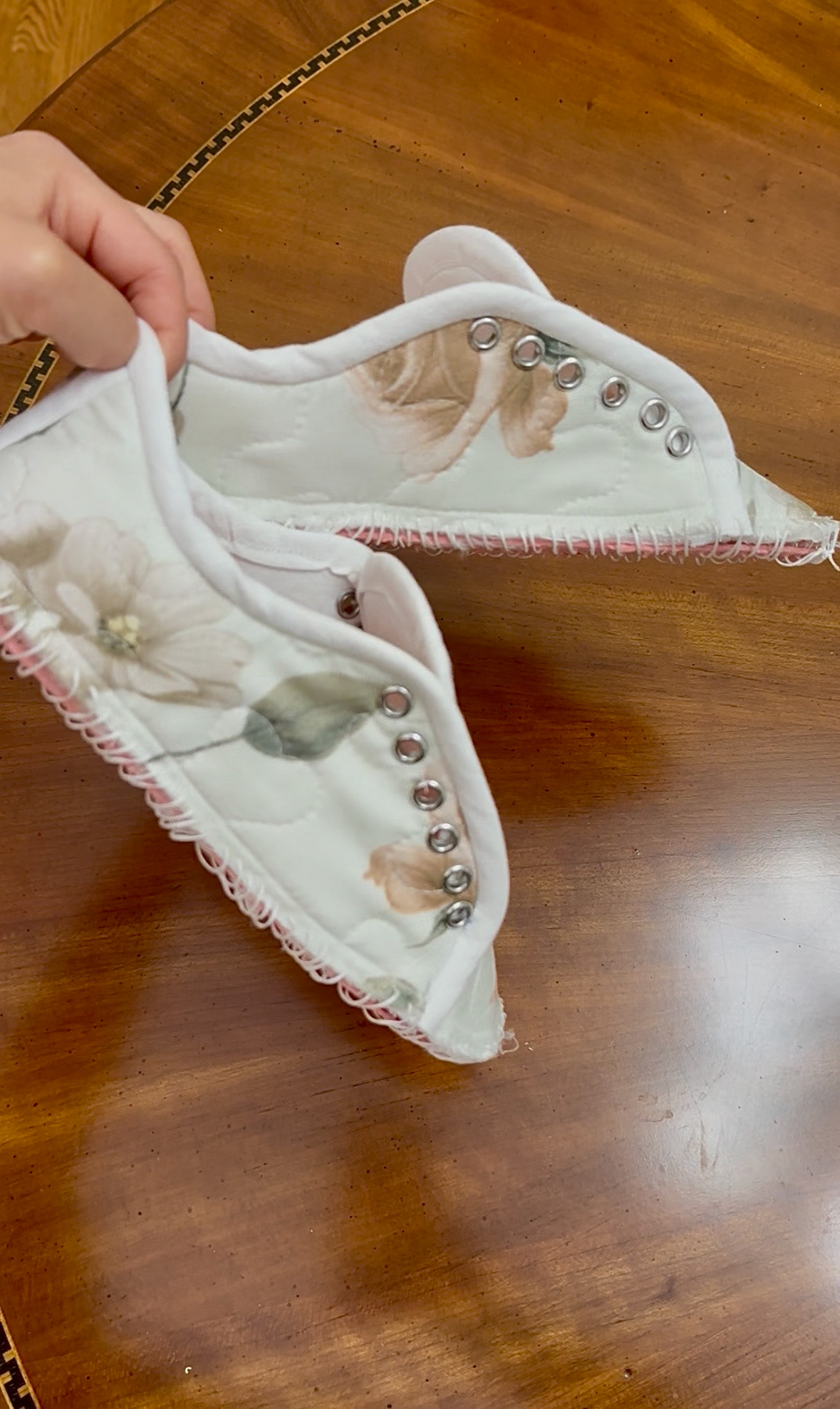 The shoe panels sewn to the footbed using an awl and wax thread.