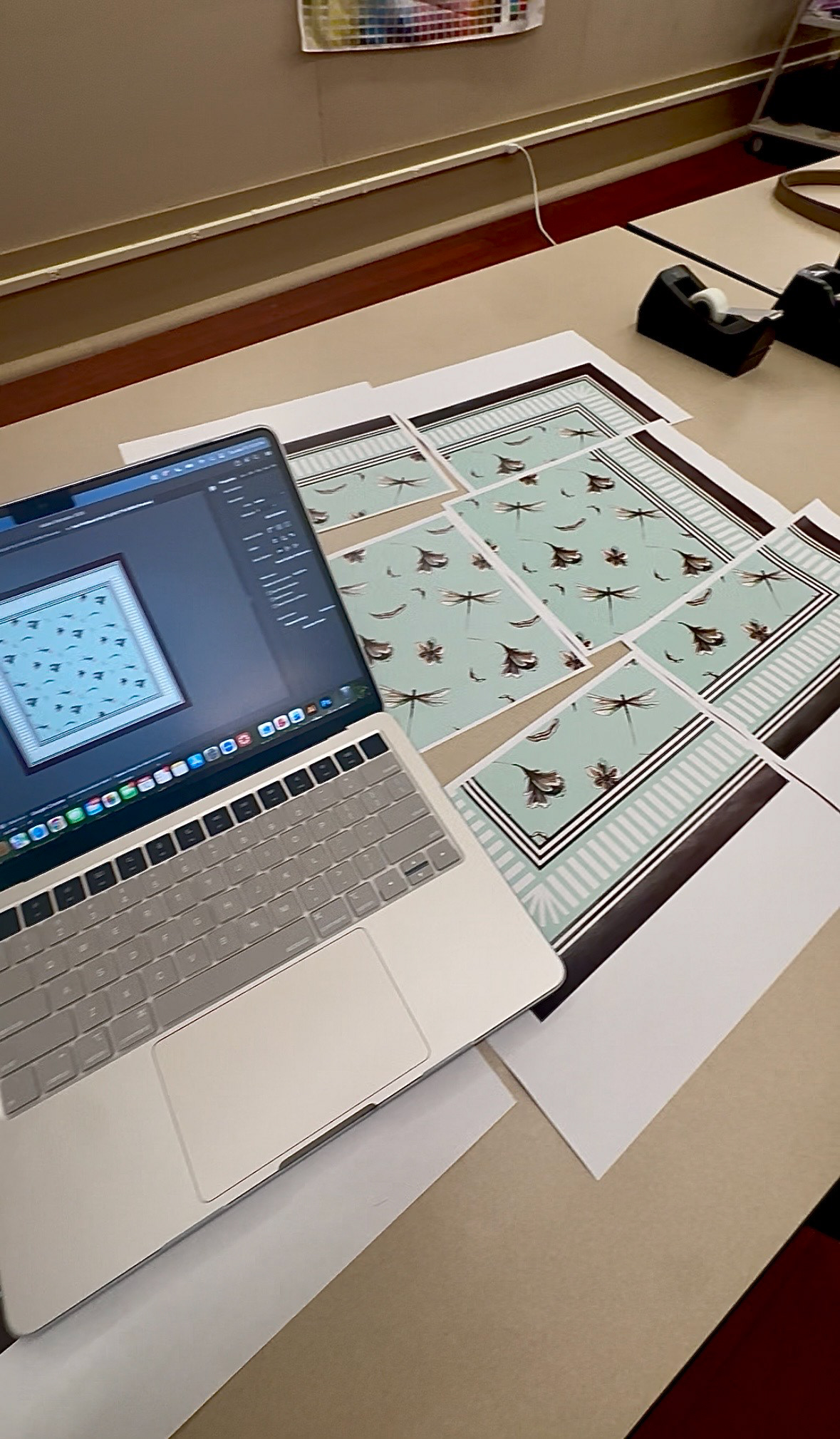The process of refining the scale and placement of the scarf motifs to ensure proper alignment.