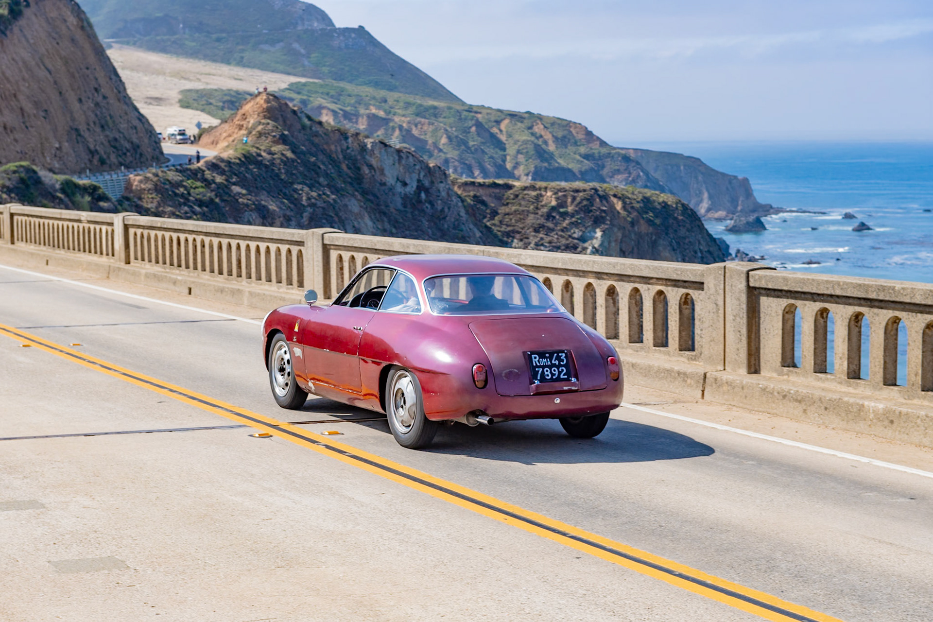 In 1956, Elio Zagato acquired a damaged Alfa Romeo Sprint Veloce and rebuilt it with a lighter, more aerodynamic body, creating a racing Giulietta to rival larger-engined GT cars. Alfa Romeo later contracted Zagato to build a small run of 200 factory-sanctioned racing cars, and the lightweight Giulietta Sprint Zagato (or SZ) dominated the 1300 GT class in endurance events, circuit races and hill climbs. This Giulietta SZ was sold to Gianni Bulgari of Rome, who raced it with Fabrizio Violati’s Scuderia Campidoglio Motori team in the 1961 Targa Florio and the four-hour Pescara Grand Prix and won his class at the Coppa Gallenga. Bulgari sold the SZ to Scuderia Settecolli for the 1963 Targa Florio, where it was driven by Mario Costantini and Corrado Ferlaino. In 1964, the car was sold to Lorenzo Garcia of New York who is believed to have used it as a daily driver before retiring it.