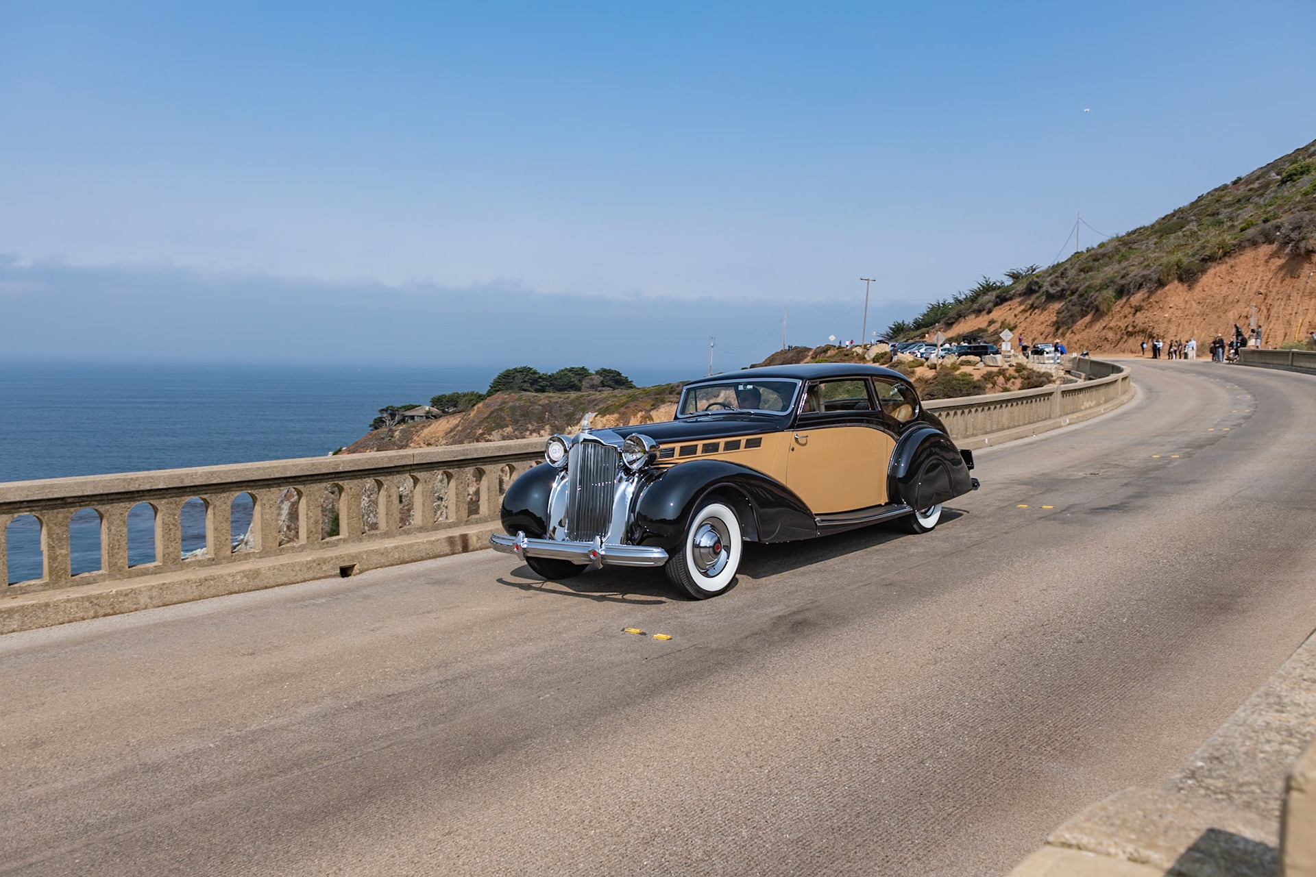 Known by Packard aficionados as the Sixteenth Series, the 1938 Super Eight quickly became the best-selling Packard of the era. Packard survived the Depression reasonably well due to the fact that it diversified its offerings; while many of its competitors were building only V12 engines, Packard realized that the cheaper-to-build 8-cylinder motor could be equally smooth and powerful, so it continued to offer both Eights and Twelves on different chassis. This unique custom-bodied Super Eight Coupe was ordered by a European shipping magnate. The bare chassis was delivered to the Mayfair Carriage Company in London to be fitted with this stylish and very British two-door body. After the war, the car was sadly neglected; it was abandoned and was being used as a chicken coop! Its rescuer, an American Naval officer, brought it back to the United States, and it has since been restored to its former glory by its current owner.