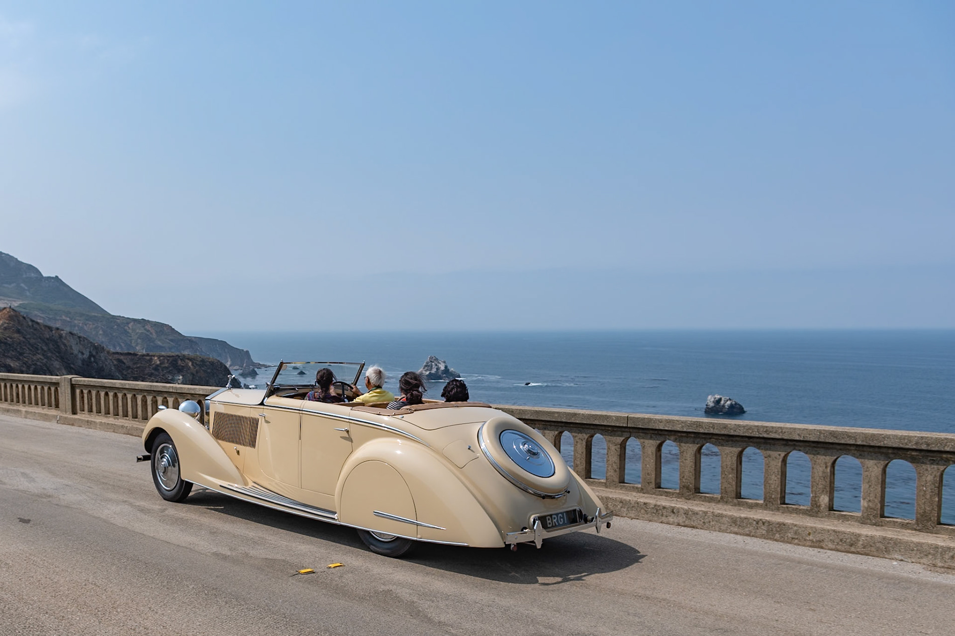 This Rolls-Royce 25/30 HP All Weather Tourer (chassis GRO48) was bodied by Gurney Nutting and supplied to the Maharajah of Darbhanga. The 25/30 HP was an entry-level Rolls-Royce with an enlarged 6-cylinder engine developed from the Rolls-Royce 20/25 HP—the same engine used in the more sporty Bentley 4¼ Litre. The car was also equipped with servo-assisted brakes built under license from Hispano-Suiza. This Rolls-Royce 25/30 HP with its 4-door, all weather, disappearing-top body, is one of three identical cars shipped to India before the war—and all three survive today. This actual car was the model used by Rolls-Royce in its Indian newspaper advertisements. It was bought by its current owner in 1973 and restored in England 20 years later. This the first time the car has been seen at Pebble Beach.