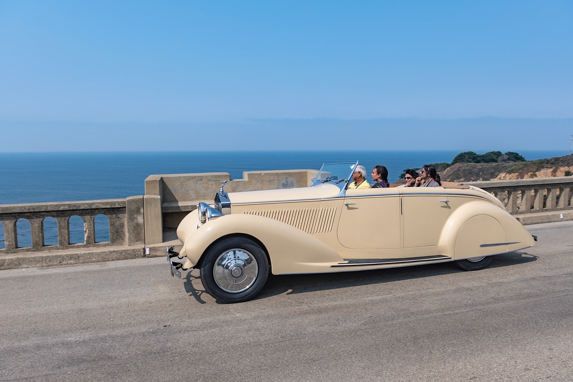This Rolls-Royce 25/30 HP All Weather Tourer (chassis GRO48) was bodied by Gurney Nutting and supplied to the Maharajah of Darbhanga. The 25/30 HP was an entry-level Rolls-Royce with an enlarged 6-cylinder engine developed from the Rolls-Royce 20/25 HP—the same engine used in the more sporty Bentley 4¼ Litre. The car was also equipped with servo-assisted brakes built under license from Hispano-Suiza. This Rolls-Royce 25/30 HP with its 4-door, all weather, disappearing-top body, is one of three identical cars shipped to India before the war—and all three survive today. This actual car was the model used by Rolls-Royce in its Indian newspaper advertisements. It was bought by its current owner in 1973 and restored in England 20 years later. This the first time the car has been seen at Pebble Beach.