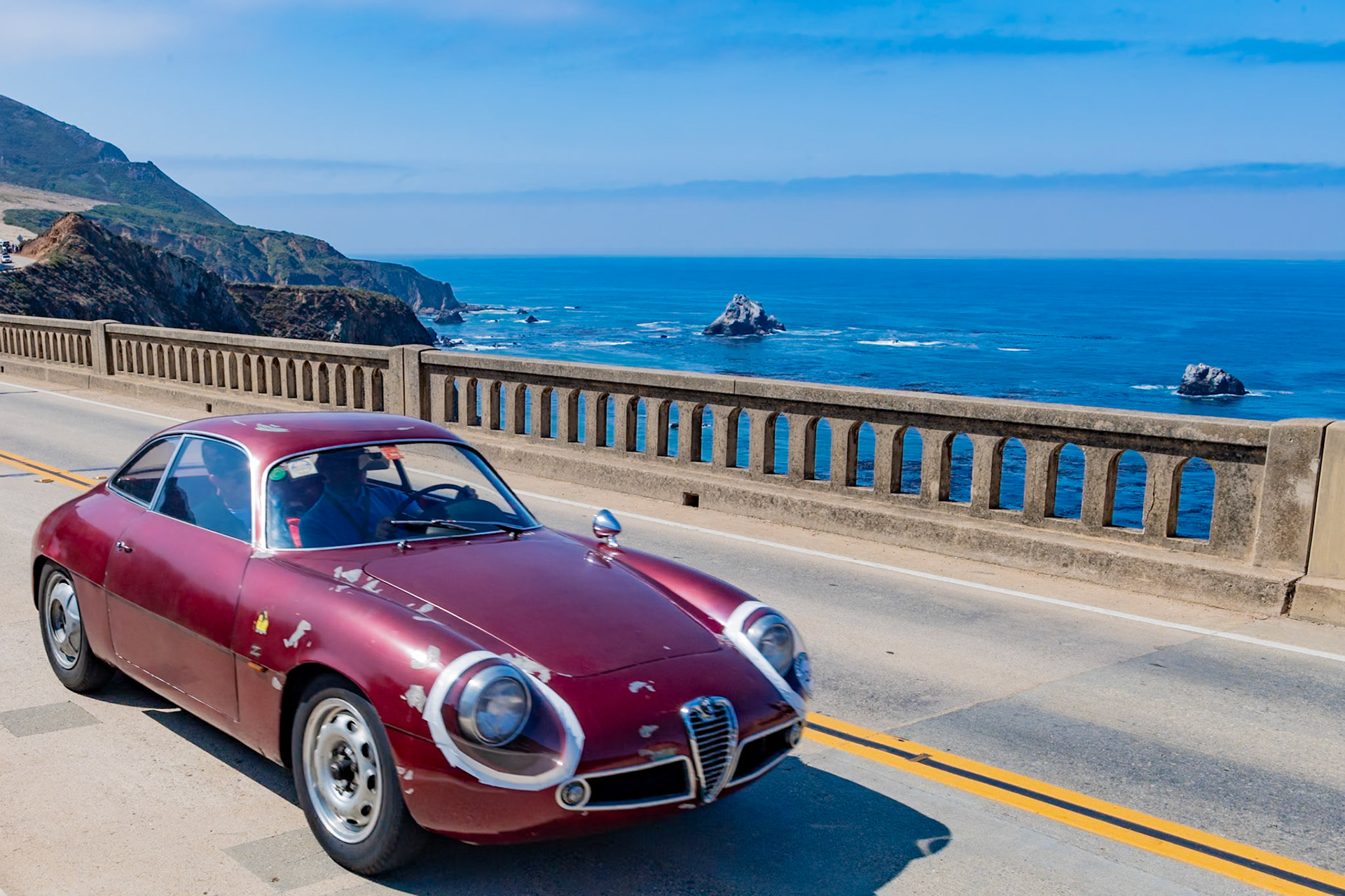 In 1956, Elio Zagato acquired a damaged Alfa Romeo Sprint Veloce and rebuilt it with a lighter, more aerodynamic body, creating a racing Giulietta to rival larger-engined GT cars. Alfa Romeo later contracted Zagato to build a small run of 200 factory-sanctioned racing cars, and the lightweight Giulietta Sprint Zagato (or SZ) dominated the 1300 GT class in endurance events, circuit races and hill climbs. This Giulietta SZ was sold to Gianni Bulgari of Rome, who raced it with Fabrizio Violati’s Scuderia Campidoglio Motori team in the 1961 Targa Florio and the four-hour Pescara Grand Prix and won his class at the Coppa Gallenga. Bulgari sold the SZ to Scuderia Settecolli for the 1963 Targa Florio, where it was driven by Mario Costantini and Corrado Ferlaino. In 1964, the car was sold to Lorenzo Garcia of New York who is believed to have used it as a daily driver before retiring it.