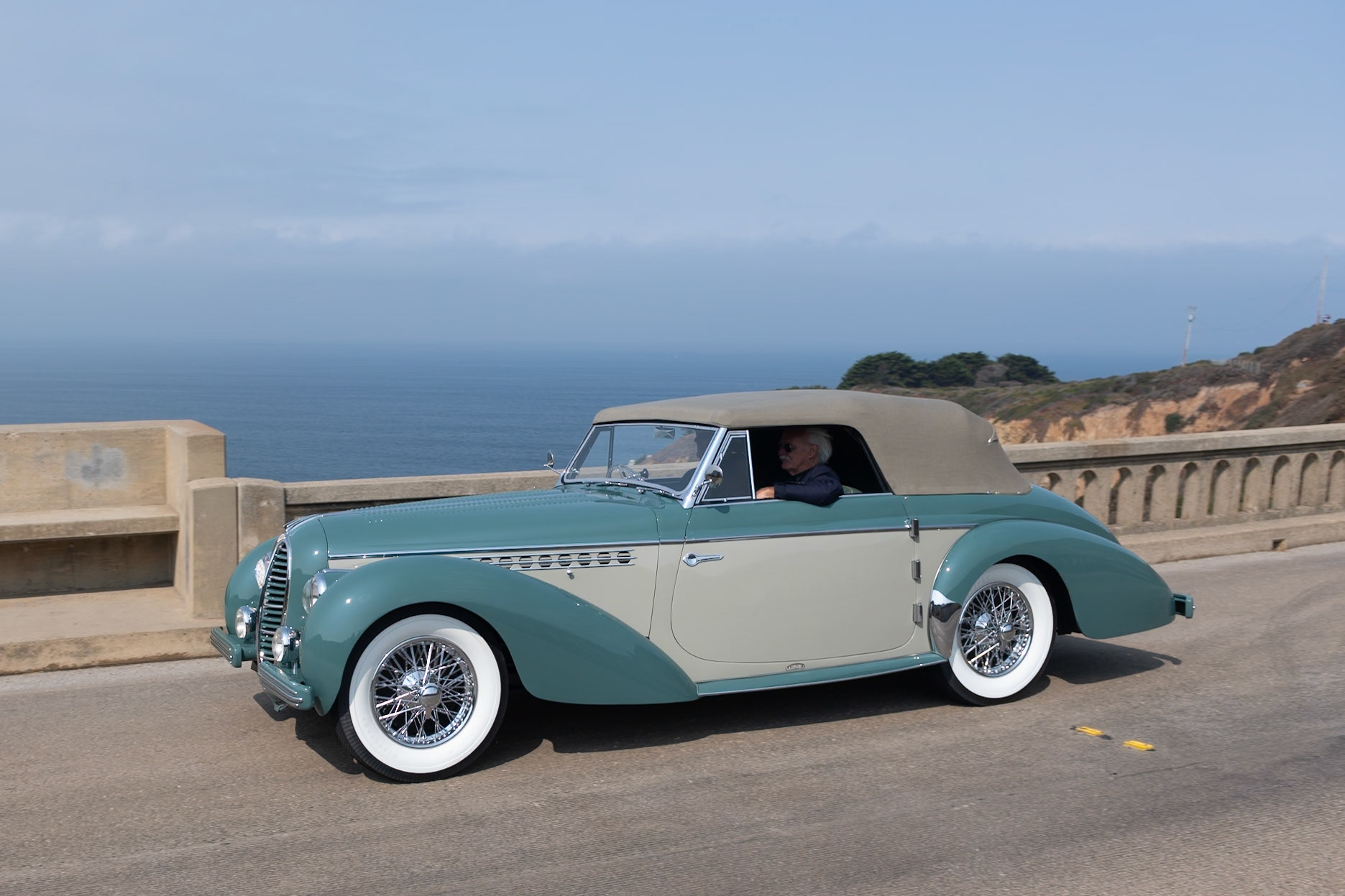 The Delahaye 135 is an important French automobile, bridging the prewar and postwar periods of engineering. The 135 M boasted a brand-new chassis with the prewar 3.6-liter, 6-cylinder engine first seen in the Delahaye Type 138. The 135 M continued to be available alongside the newer Delahaye 235 until the demise of the company in 1954. This 135 M cabriolet (chassis 801221) was bodied by Alphonse Guilloré, a small coachbuilder from the Courbevoie-sur-Seine suburb of Paris. Its subtle lines create a balance between the extravagant work of Jacques Saoutchik and the more restrained designs of Henri Chapron. The early history of this car is unknown, but by the early 1960s it was owned by designer Brooks Stevens and displayed in his museum in Mequon, Wisconsin. Later the car was sold to Richard Adatto, who restored it for the 1984 Pebble Beach Concours, where it was named First in Class. The Delahaye then completed the Monte Carlo Rallye Historique in 1985. It was sold to its current owner in 2016 and has now been freshly restored.