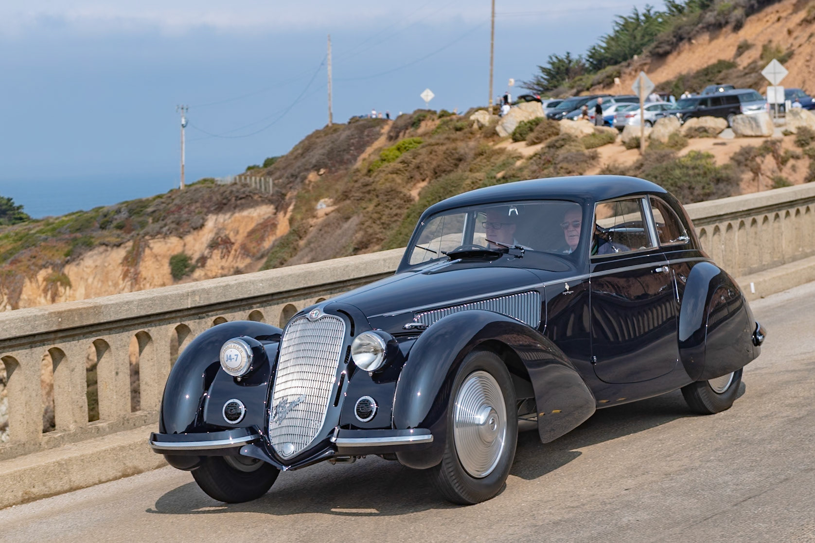 The Alfa Romeo 8C 2900 was probably the most technically advanced, modern, and compelling sports car that money could buy in the 1930s, and this particular 8C 2900B (chassis 412020) Lungo Berlinetta with Superleggera coachwork was a seminal work for both Alfa Romeo and Carrozzeria Touring. It was revealed to the world at the 1937 Paris Auto Salon, then appeared at the 1937 Milan Auto Show and at the 1938 Berlin Motor Show. It was also featured in many period magazines and in the Alfa Romeo sales brochure, where it was called the “Coupé Leggero.” It differs from the later 8C 2900 Berlinettas by having a more steeply raked aerodynamic front grille and no running boards. The car is believed to have remained in Germany through the 1950s. It was brought to the United States in 1956. This historic Alfa Romeo was first restored in the 1990s and was named Most Elegant Closed Car at the 2001 Pebble Beach Concours d’Elegance. The current owner has now restored the car to its 1938 Berlin Motor Show specification.