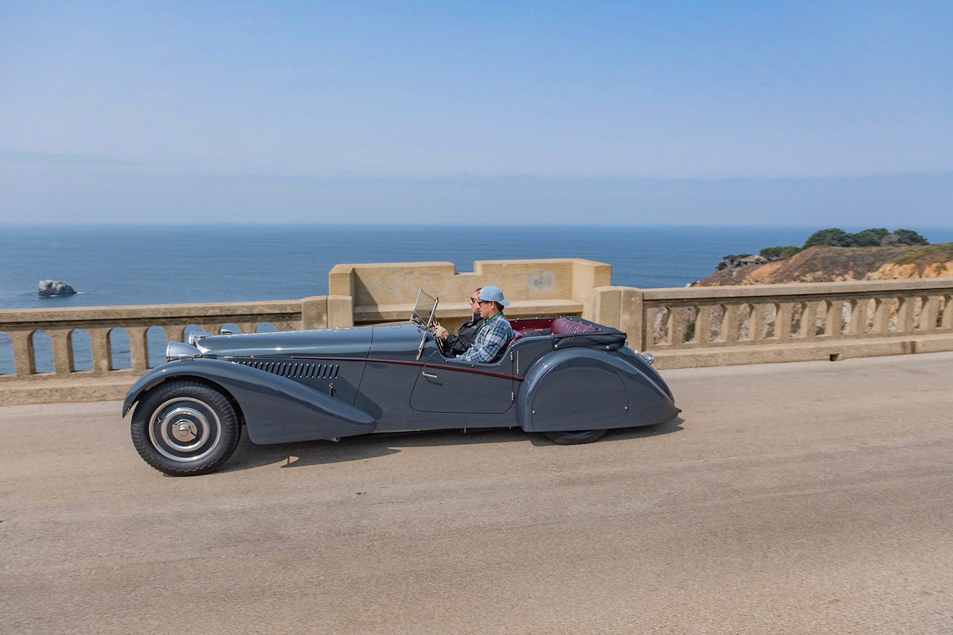 This Bugatti Type 57S (chassis 57541) was originally ordered from the marque’s London agent by American racing driver George Rand. The bare chassis was sent to Vanden Plas to build a sports tourer body similar in style to a Bugatti owned by Malcolm Campbell. The finished car was shipped to New York, where it was first driven in the A.R.C.A. races on September 25, 1937. Afterward, the car was shipped back to London to be sold, and it was shown on the Bugatti stand at the 1938 Olympia Motor Show. In 1947, Jack Robinson bought the car and exported it to Trinidad where, equipped with a Type 35B supercharger, it was raced by Robinson at the Trinidad Aerodrome. There it remained for more than thirty years before returning to England with British collector Peter Agg, who rebuilt it and regularly used it in vintage hill climbs and circuit races. Its current owner acquired the car in 2016 and has returned it to its original specifications, complete with its original Vanden Plas body panels and original engine.