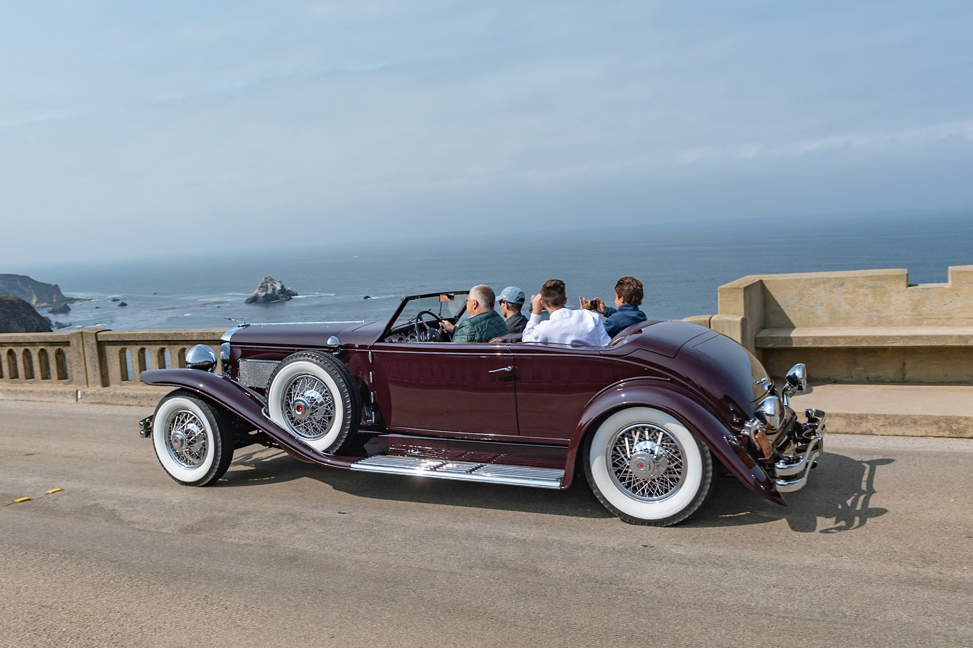 The Duesenberg SJ, introduced in 1932, had a supercharged, dual overhead cam, 8-cylinder, 320 hp Lycoming engine and was one of the most powerful motorcars in the world, capable of a top speed approaching 140 mph. That engine, combined with this Rollston Torpedo Convertible Victoria coachwork, makes this Model SJ (J-517), finished in November 1933, one of the most stunning Duesenbergs ever created. It was purchased new by Miss Margaret Flick, later to become Mrs. Margaret Hoffman of New York City. It was later acquired by Vernon Jarvis in 1955, who lent his entire car collection to the Early American Museum in Silver Springs, Florida. The Bahre Collection purchased it in 1986 and restored to its original Roosevelt Maroon paint scheme with black top, which it still wears today.