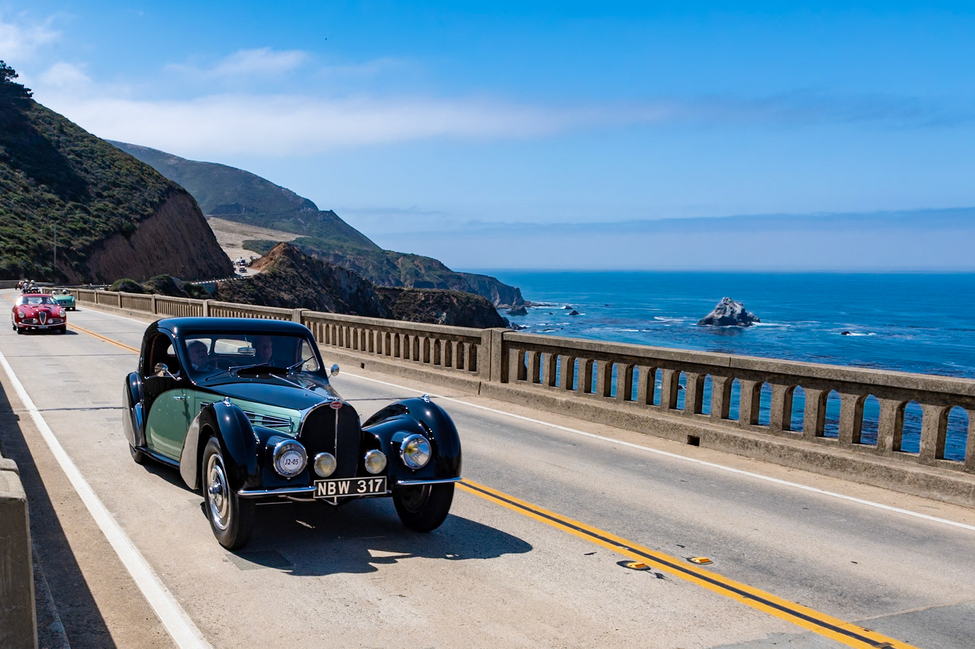 The Bugatti Type 57S was built in Molsheim between 1936 and 1938. The “S” stood for surbaissé, meaning lowered, but the car was in effect an entirely new sports car. The new model was an immediate success although just 43 Type 57S chassis were built by the factory. The high-compression engine was also offered with a Roots supercharger, and only two of these supercharged S chassis were sold by Bugatti although many chassis were later uprated. The Type 57S was available with factory-built Atalante coachwork, but the chassis was often bodied by other coachbuilders. This example (chassis 57501) has a coupé body by Gangloff with lines similar to the Atalante. The unique 3-seater was fitted for its first owner, Camille Jourde. The car later spent a short period at the Schlumpf Museum in Mulhouse, France, but then was brought to America. It was last shown at the 2007 Pebble Beach Concours d’Elegance where it was awarded the coveted French Cup.
