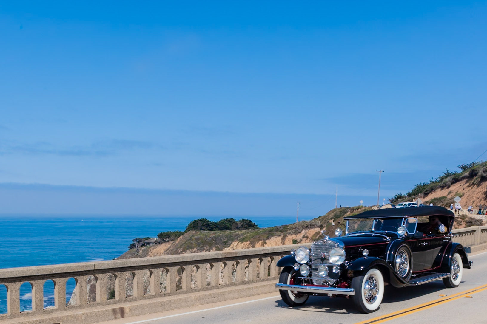 Cadillac introduced its new and luxurious V-16 automobile at the 1930 New York Salon in response to the Duesenberg Model J that had amazed the world when introduced in late 1928. The V-16 had an equally impressive performance, displacing 452 cubic inches and producing 185 bhp. Only 85 Fleetwood sport phaetons were produced on the V-16 chassis and today these cars are extremely rare. This example is fitted with attractive dual cowl coachwork; the cowl for the rear-seat passengers is mounted directly to the rear of the front seat and is raised and lowered by turning a small crank. This gives the car its distinctive low line. The body is sometimes referred to as a four passenger roadster.