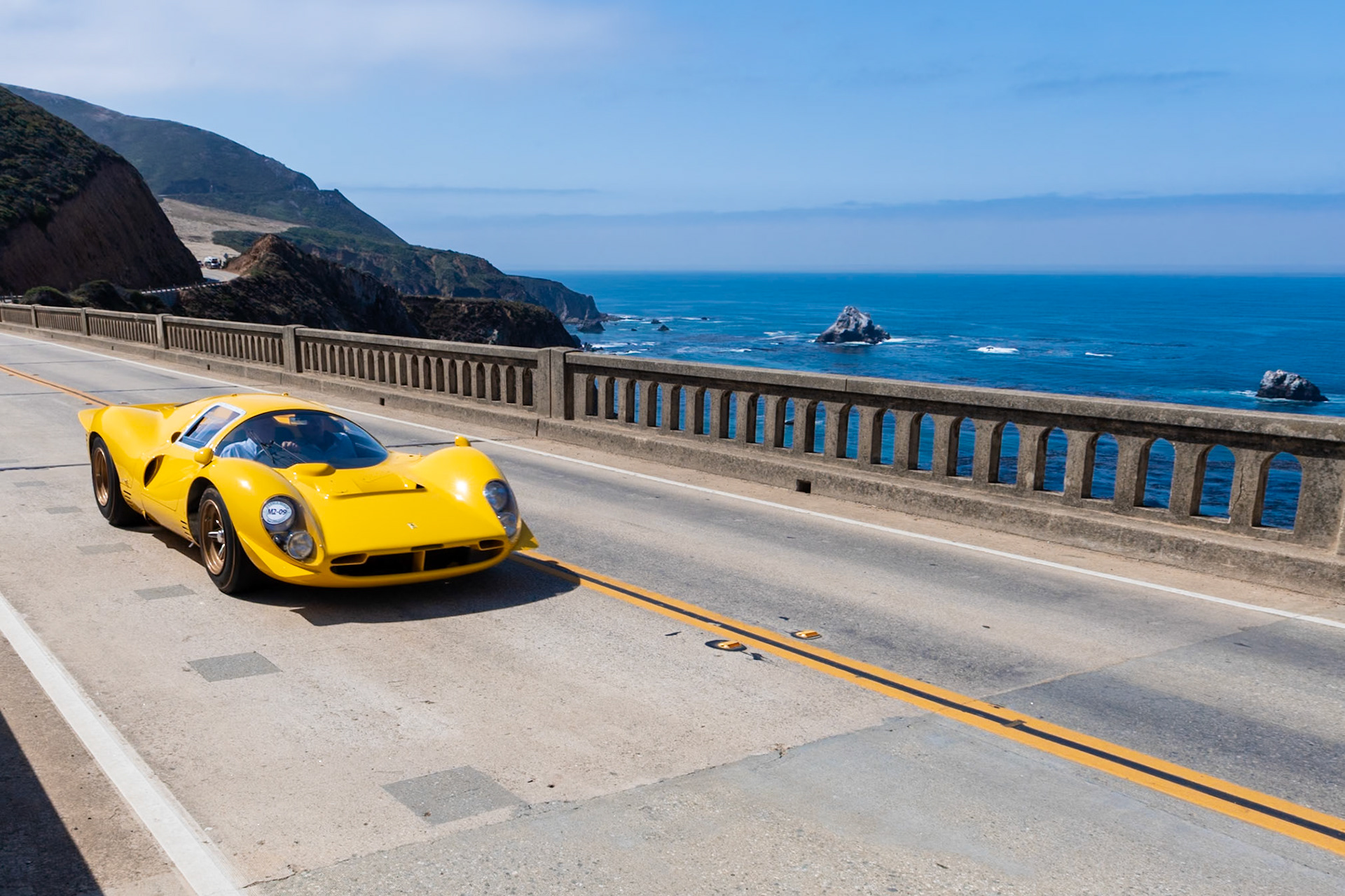 To replace the successful Ferrari P3, the factory developed the intermediate 412 P race car—also known as the P3/4. Designed by Mauro Forghieri, the 412 P features an aluminum body that owes its shape to the Ferrari wind tunnel, and the car develops 420 bhp due to its 4-liter, V12 engine with six Weber carburetors. This 412 P (chassis 0850) was purchased by the Ecurie Nationale Belge team of Jacques Swaters, and it raced in bright yellow livery at various events in 1967 and 1968. It finished second overall at the 1,000 km Race at Montlhéry in 1967 and it won the Cote de Condroz and Cote de la Roche Hill Climbs in 1968. The car was also entered in the 1967 24 Hours of Daytona when Ferraris famously finished 1-2-3. After its racing days concluded at the end of 1968, the 412 P was converted to street use for Dean Martin Jr. and was often seen on roads around Hollywood. It is shown here at Pebble Beach for the first time since being restored to its original racing specification.