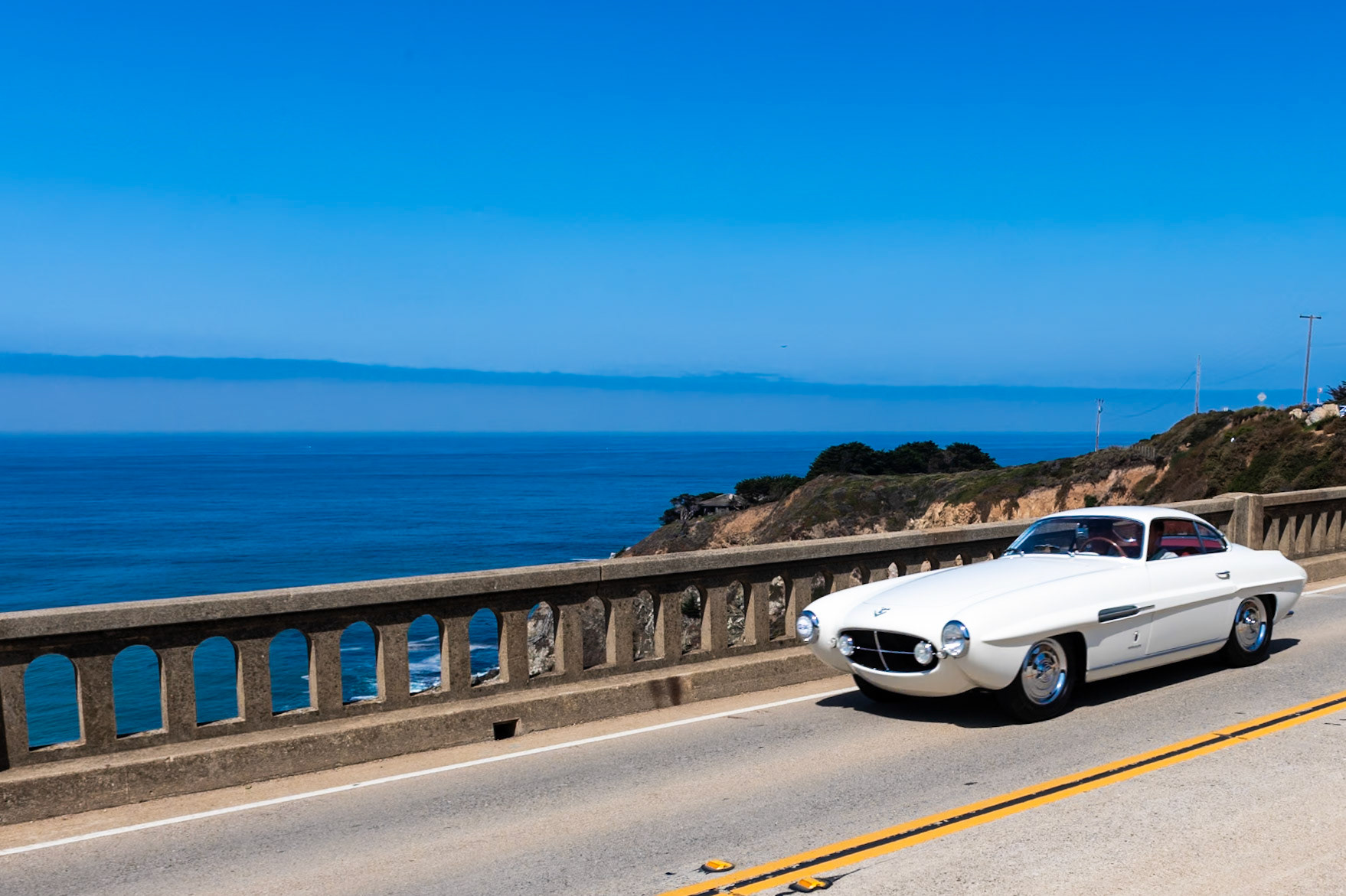 The Fiat 8V (the Otto Vu) made its public debut at the Geneva Auto Salon in March of 1952. The car was powered by Fiat’s new 70-degree, overhead-valve V8 engine designed by Dante Giacosa. A total of 114 examples of the 8V were built, and 40 of these had Fiat factory coachwork while the rest were finished by other Italian carrozzerie. Ghia built 15 of these 8V Supersonics designed by Giovanni Savonuzzi. This car is thought to have been the one shown at the 1954 New York Auto Show. The original owner of this car was Howard “Dutch” Darrin, who then sold it to Briggs Cunningham. It was one of two Supersonics bought by Darrin; he later sold the other one to actress Lana Turner. This car disappeared for a time, but in 1962 it was spotted in Beverly Hills without its original engine and transmission and painted red. Its current owner has restored the car, reuniting it with its original engine and returning it to its original paint color and trim.