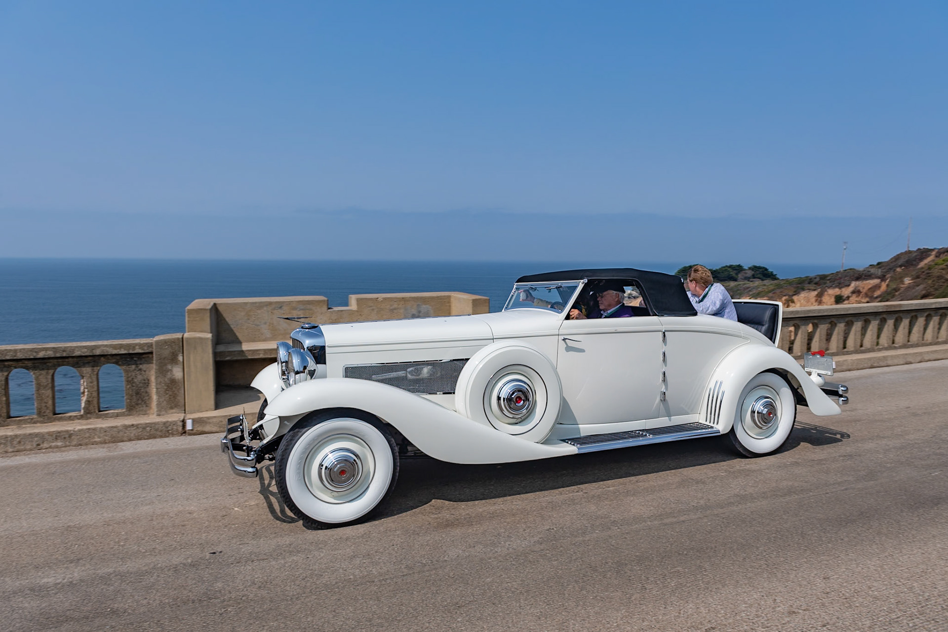 The rarest and perhaps the most desirable Duesenberg model is the SJN, which combines a supercharged SJ engine with the lower and wider bodywork from the JN, first seen in 1933. Only five Model JN convertibles were built by Rollston, and this car (J-564) is the only one with a factory-equipped supercharger. All of the Rollston convertibles were designed by Herb Newport, and the first one was bought by Hollywood legend Clark Gable. Aluminum alloy was used extensively in the engine as well as many other mechanical components, which kept the weight of this massive car down to just under 5,200 pounds and allowed even an un-supercharged Model JN to achieve a staggering 89 mph in second gear and over 120 in top. This car was owned for nearly 60 years by the same family before being acquired by its current owner in 2000. Since then it has been sympathetically refurbished, keeping almost all of its original features intact.