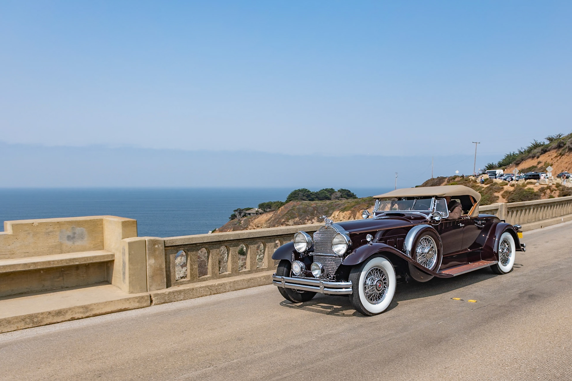 The Seventh Series Packards were introduced toward the end of 1929 just as the Stock Market began to tumble and customers for expensive motorcars were hard to find. Packard survived in part due to the marque’s reputation for reliability as well as its beauty, luxury and comfort. The big Packards were available on two chassis, the 140-inch Model 740 and the 5-inch-longer Model 745. Finished with either a factory body or a coachbuilt design they came with a selection of radiator mascots, including the Deluxe Goddess and the Adonis. Fewer than 1,800 Packard 745s were sold of which around 50 were roadsters. Beneath the long hood of this desireable Deluxe Eight Roadster lies a 385-cubic-inch, straight-8 engine. The factory body is fitted with a folding rear rumble seat windshield, and the car has chrome wire wheels and dual Pilot Ray fog lamps.