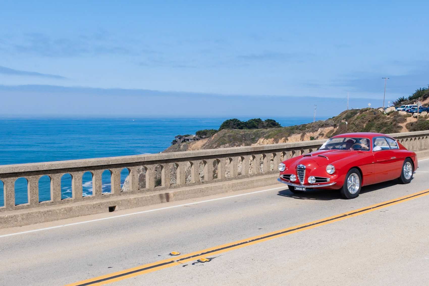The first Alfa Romeo 1900 saloon was introduced at the Paris Auto Show in 1950. Advertised as the “family car that wins races,” the sporty model included a new 90 bhp, twin overhead cam, straight-4 engine and independent front suspension with Alfin drum brakes. Beginning in 1952 Alfa also produced a shorter chassis that was bodied by several carrozzerie, and these chassis were fitted with larger 1975 cc engines with twin Solex downdraft carburetors that produced 115 bhp. This short-chassis coupé is one of fewer than 30 Super Sprints built by Zagato. It was raced throughout Europe, participating in the Coppa d’Oro, the Coppa Inter-Europe, the Bolzano-Mendola, and the Trieste-Opicina and made three consecutive appearances in the Mille Miglia from 1955 to 1957. Its current owner has entered the car in the Mille Miglia five times and in the Tour de France twice.