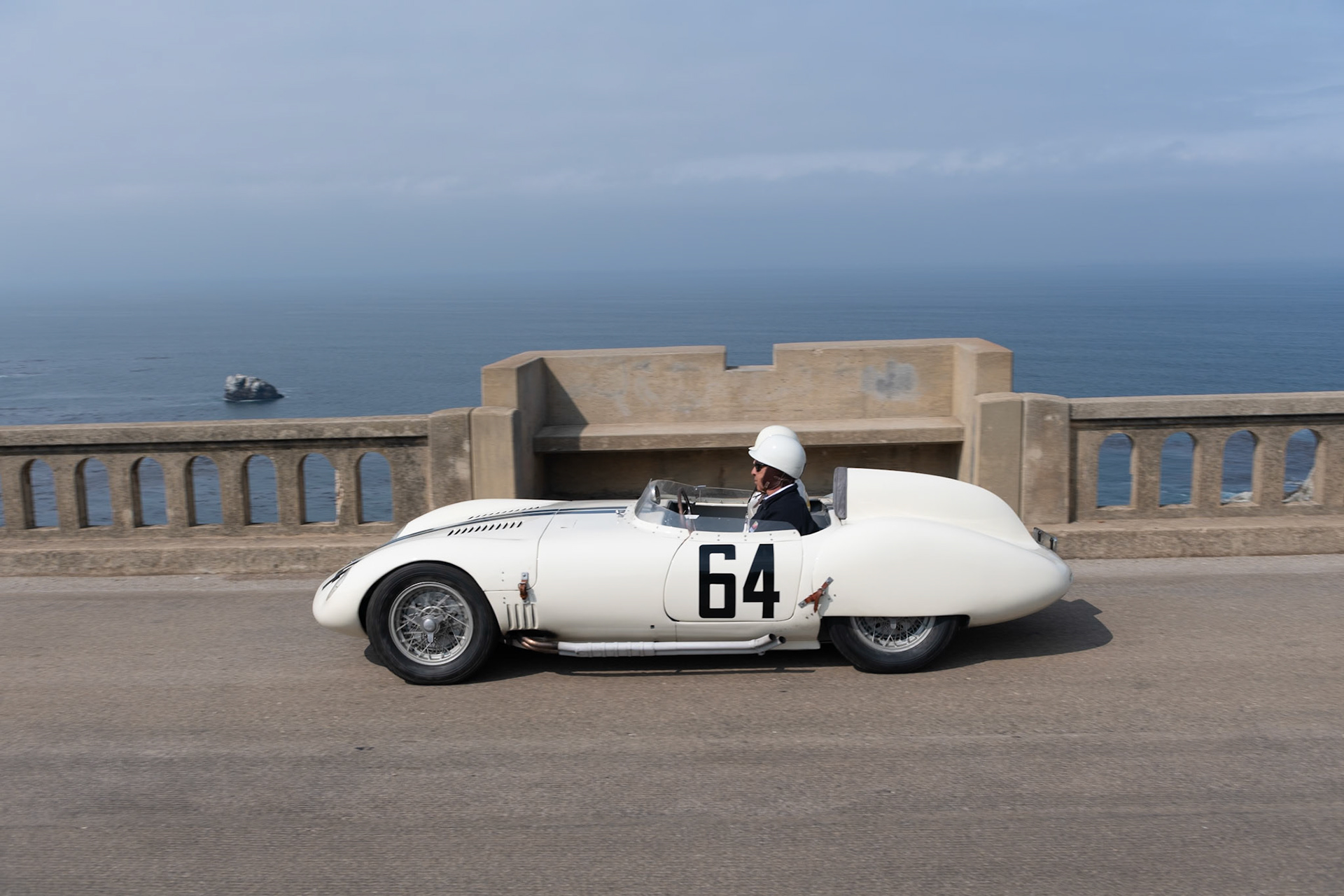 The OSCA S273 was originally designed for the 1100 cc OSCA engine, although this car (chassis 767) was fitted by the factory with the tiny 750 cc 4-cylinder, 75 bhp motor. It was ordered by Briggs Cunningham and was delivered in the summer of 1959 to Cunningham’s race manager, Alfred Momo in New York City, who prepared it for the Cunningham team. Cunningham owned several OSCAs in period, and the S273 was entered at six events during 1959. The car’s most significant race was at the 1960 12 Hours of Sebring, where it was co-driven by Denise McCluggage and Marianne Windridge. After that the car was not used again by the Cunningham team and was sold to privateer Cecil Schoeneman who drove it in several races in the Midwest. At this point, the original 750 cc engine was at the end of its life, and a larger 860 cc Tipo 187 engine was fitted. Then the car was sold to Dr. John Hunholz of Washington. He restored the OSCA, keeping it for the next four decades, until its current owner acquired the car in August 2015. It has now been restored again and wears its original Cunningham livery.
