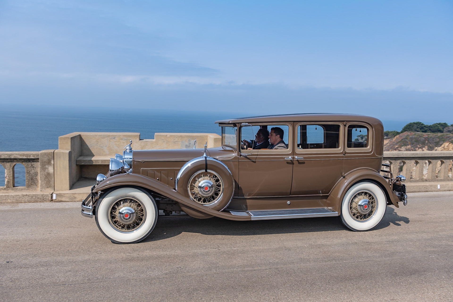 In 1931, most American car manufacturers were feeling the effects of the Great Depression, and Packard was no exception. Packard’s plan for survival was to concentrate solely on its top-of-the-range lineup, the 826 and 833 Standard Eight and the more expensive 840 and 845 Custom or DeLuxe Eight. This Packard 840 5 Passenger Sedan was loaded with accessories by Earle C. Anthony, Packard’s San Francisco dealer. These included chromed spare tire covers, a radiator stone guard, and a special Adonis hood ornament, all of which have remained with the car throughout its life. The original black fenders were repainted to match the rest of the chocolate brown body before the car was delivered. About ten years later, and with less than 40,000 miles on the clock, the car was put in storage. It was found by our esteemed Chief Judge, Chris Bock, who purchased the car from the son of the original owner in 1963. After a further two owners, and still in unrestored condition, it was bought by the current owner in 2009.